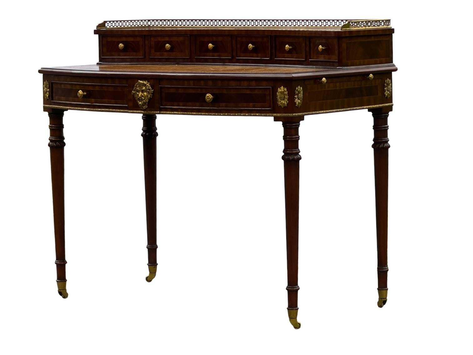 Very nice Maitland Smith desk with expanding sides, authentic leather top and shiny brass detail, feel free to reach out with any questions