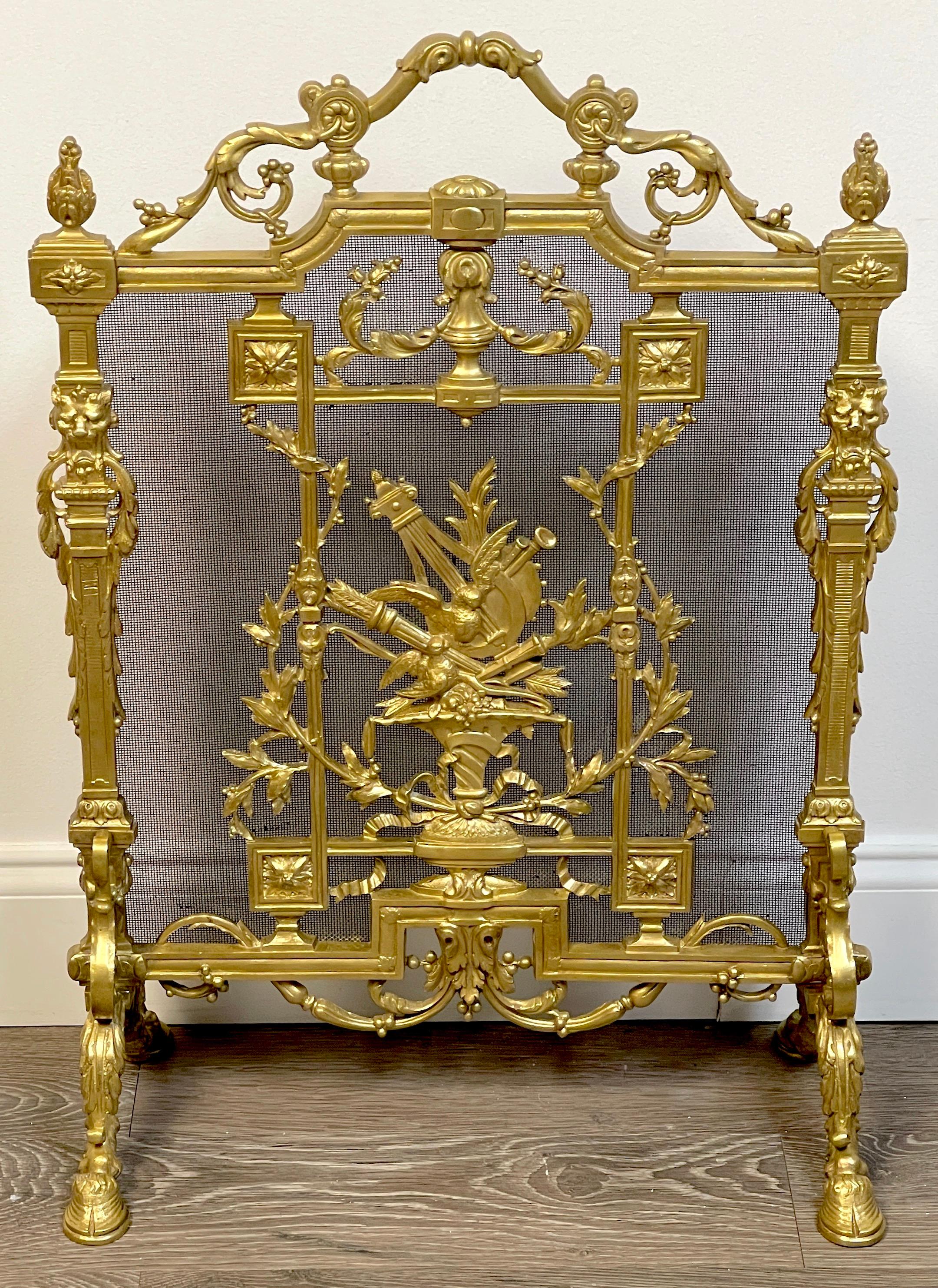 Exquisite Louis XVI style ormolu firescreen, Paris C 1890
Of upright rectangular form with handle, Flanked by twin lion motif columns, raised on hoof feet, supporting the Fine black wire mesh mounted with a central classical vignette of a urn with