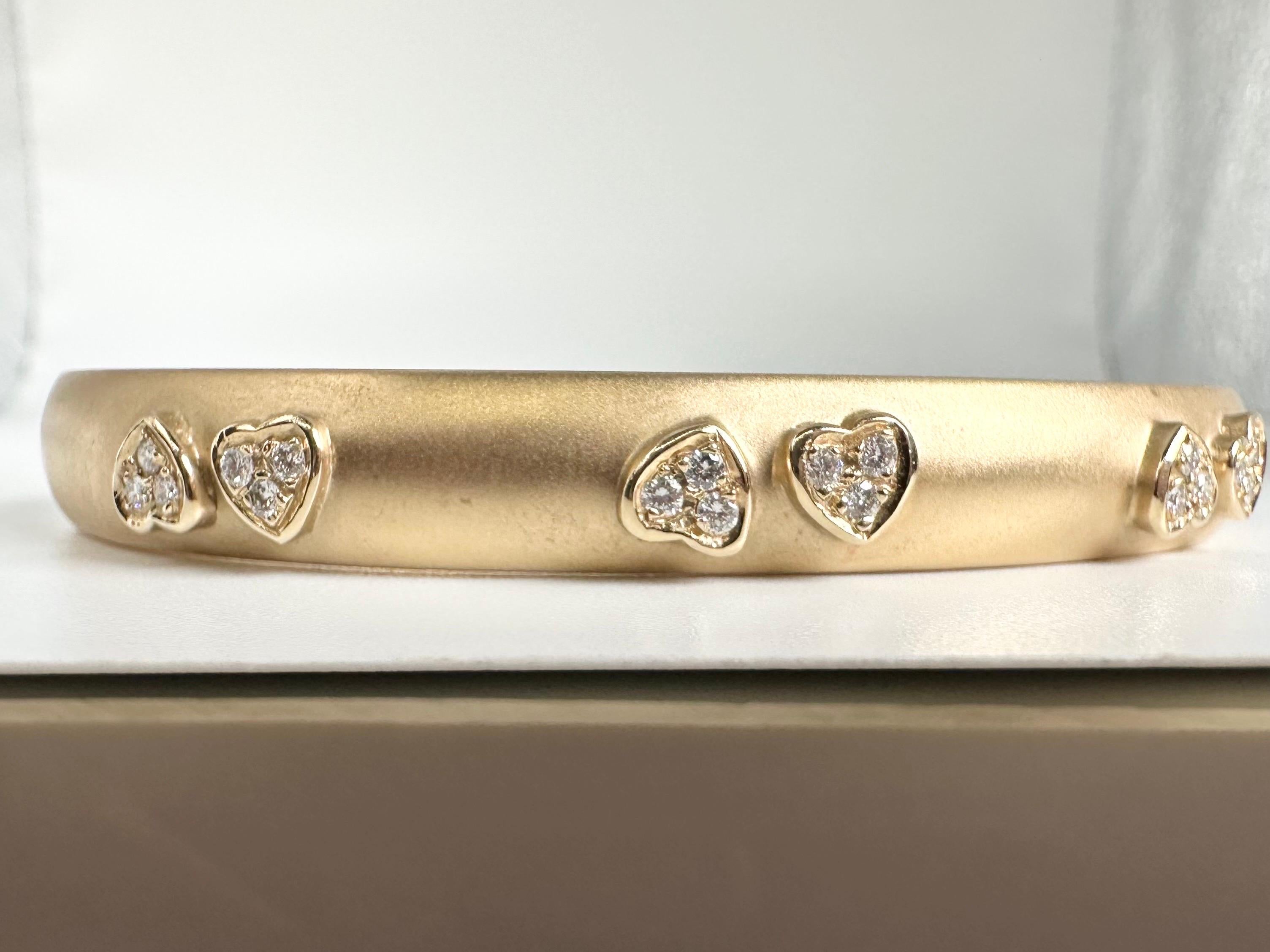 What a wonderful piece, stunning mate finish complimented by dazzling white diamonds inside little hearts, a beautiful classical bangle with a substantial weight! A well crafted lifetime jewelry piece indeed!

GOLD: 14KT gold
NATURAL