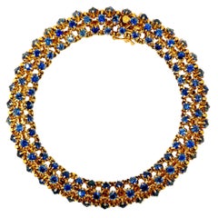 Bracelet français exquis du milieu du 20e siècle en or 18 carats et saphirs