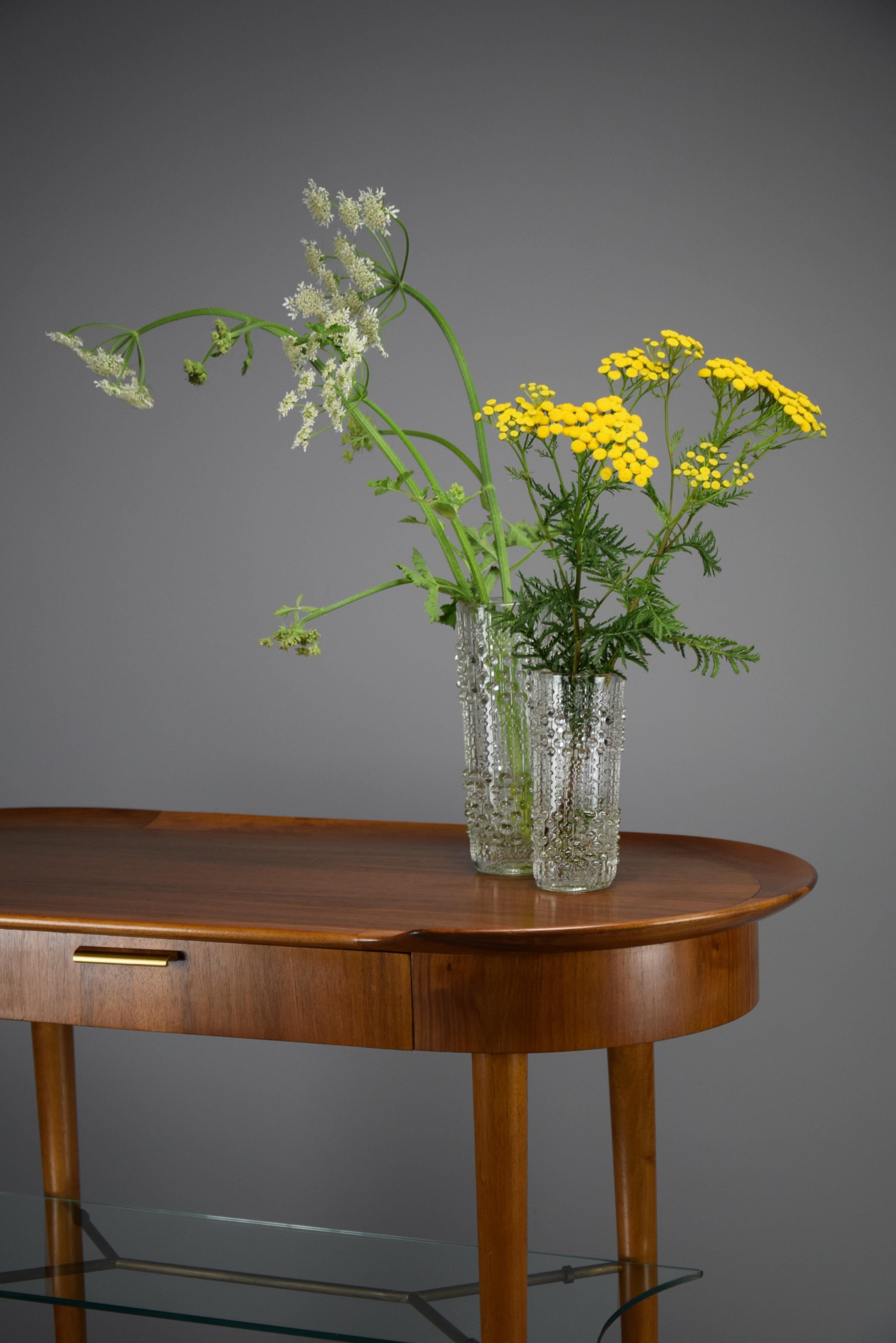Introducing a masterpiece of mid-century design : a stylish and sophisticated entrance side table designed by the renowned A.A. Patijn and produced by Zijlstra in Joure, the Netherlands.

This exquisite piece showcases Patijn's dedication to form