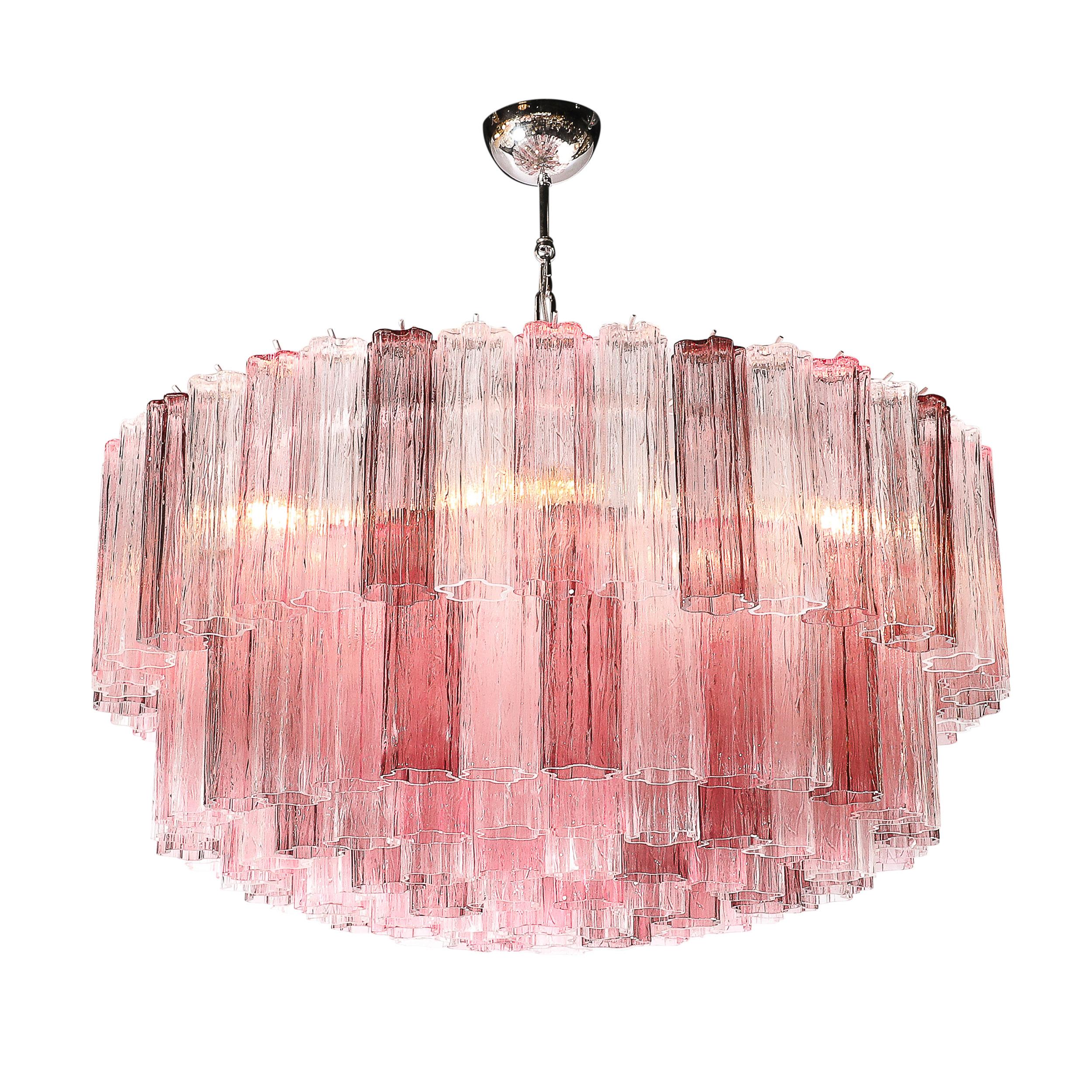 This exquisite modernist tronchi chandelier, crafted in Italy in the 21st century, is a dazzling testament to the artistry of Murano glassmakers and their ability to innovate within tradition. Composed of hand-blown mixed fuschia glass elements, the