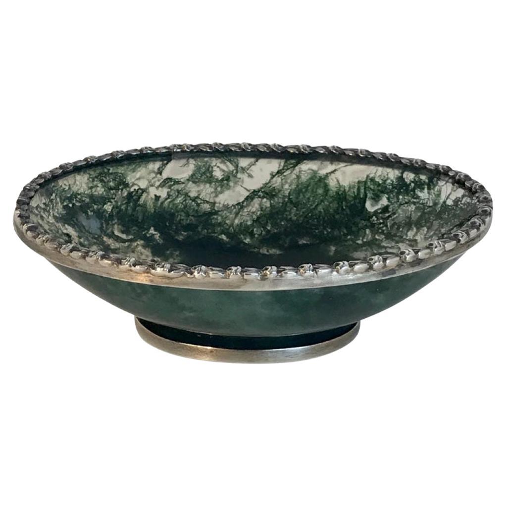 Exquisite Moss Agate Pedestal Bowl with Silver Mounts, Unmarked, Early 20th Century

A refined and sculptural small pedestal bowl carved from richly patterned moss agate and elegantly mounted with silver trim. This beautifully balanced form measures