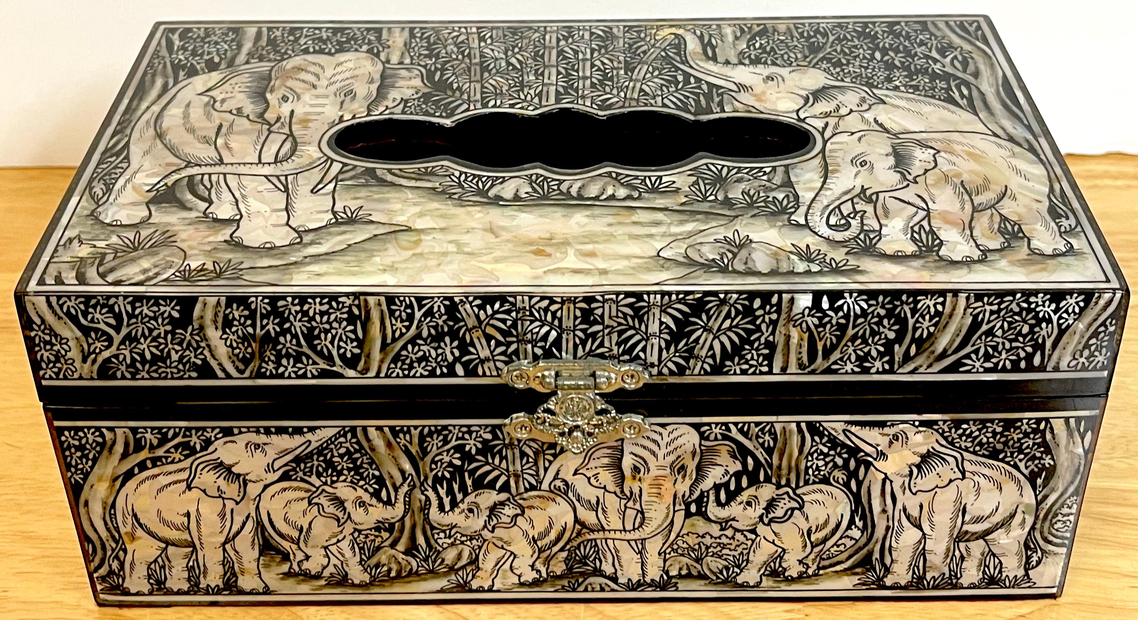 Exquisite mother of pearl inlaid lacquer elephant motif tissue box, 
Intricately inlaid all over with numerous elephants in landscape. Fitted with a silverplated clasp, and a velvet interior. 
The scalloped opening measures 5.5