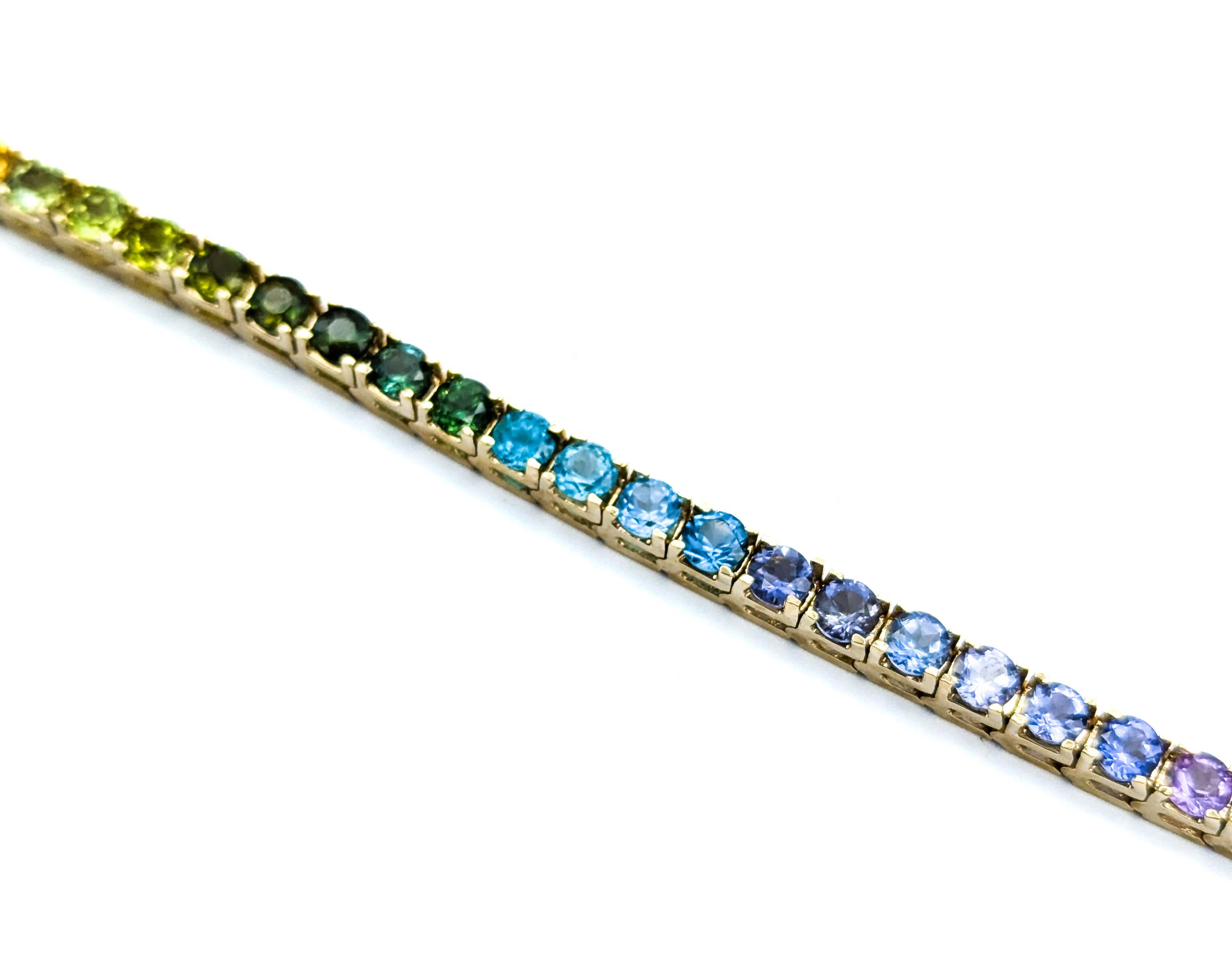Exquisites Tennisarmband mit mehreren Edelsteinen aus 14k Gelbgold 3