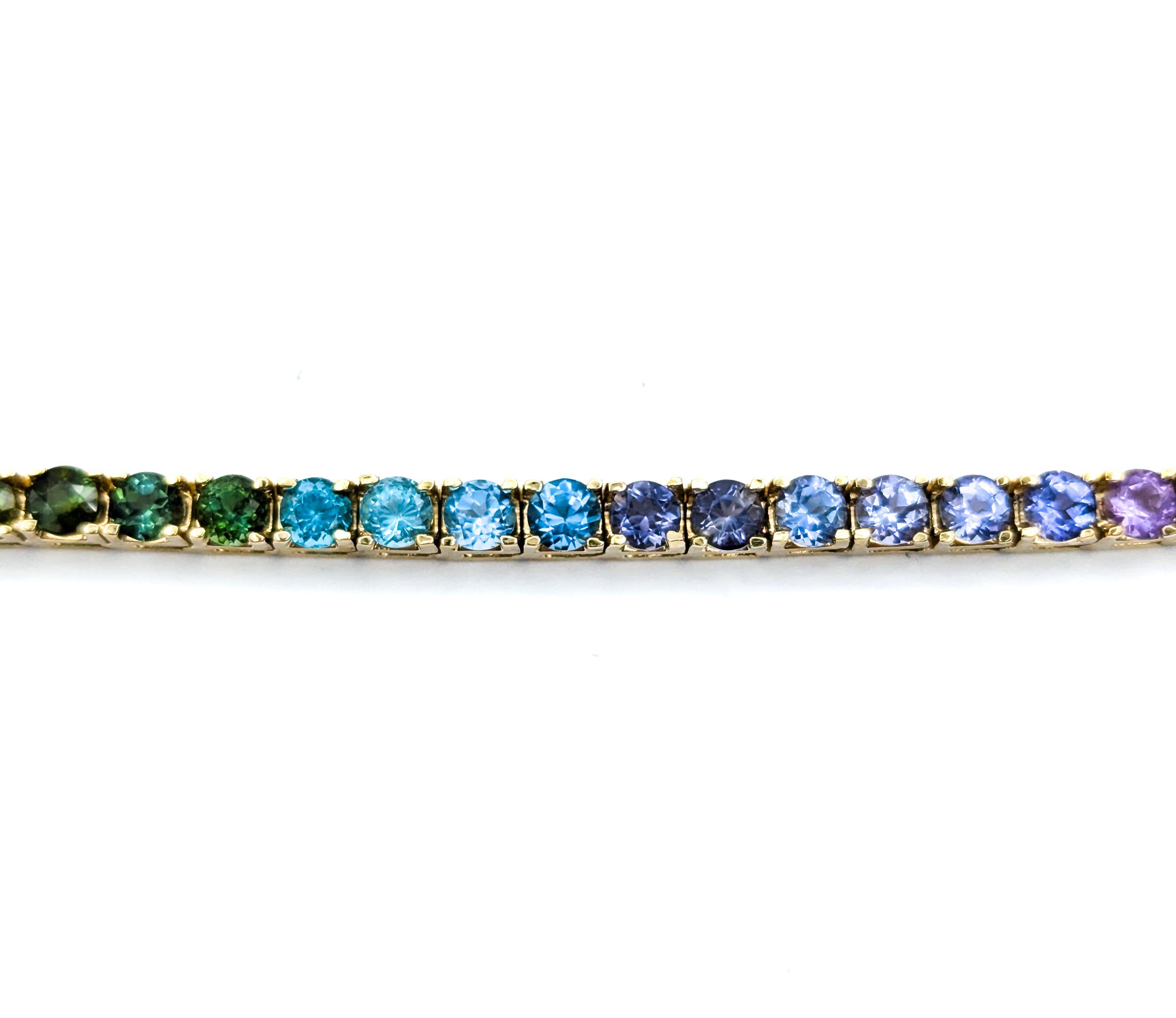 Exquisites Tennisarmband mit mehreren Edelsteinen aus 14k Gelbgold 4