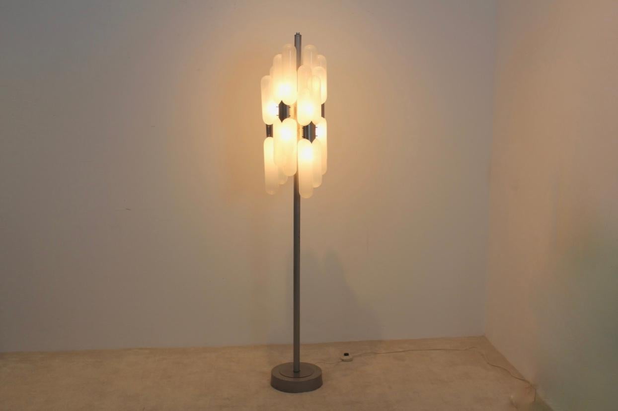 Beautiful sculptural floor lamp designed by Carlo Nason in the 1960s in Italy for Mazzega. This very unique lamp with ten lights consist of a steel base with ten ‘Murano glass bulbs’. It has some wear due to the age and use but still in very good