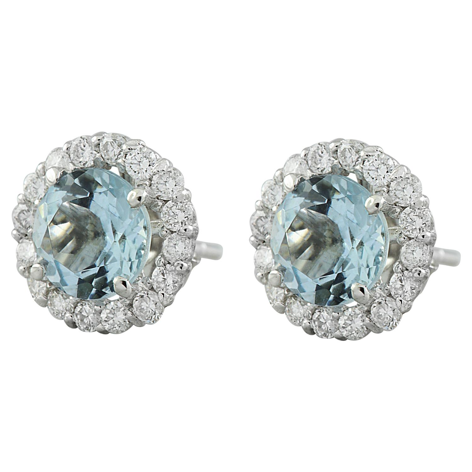 Introducing our stunning 14 Karat Solid White Gold Diamond Earrings featuring a captivating 3.65 Carat Natural Aquamarine centerpiece, stamped for authenticity. Weighing 2.3 grams in total, these earrings exude elegance and sophistication. The