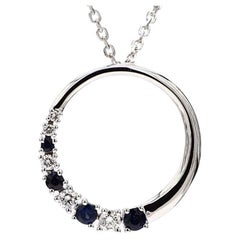 Natural Blue Round Sapphire and White Diamond .38 Carat TW White Gold Pendant