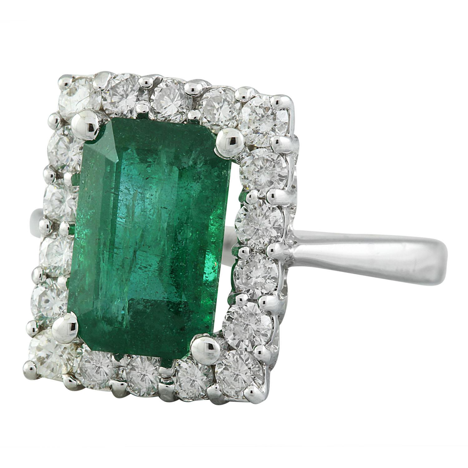 Introducing our exquisite 14 Karat Solid White Gold Diamond Ring, showcasing a stunning 4.22 Carat Natural Emerald, stamped for authenticity. Weighing 5.3 grams in total, this ring exudes elegance and sophistication. The captivating Emerald weighs