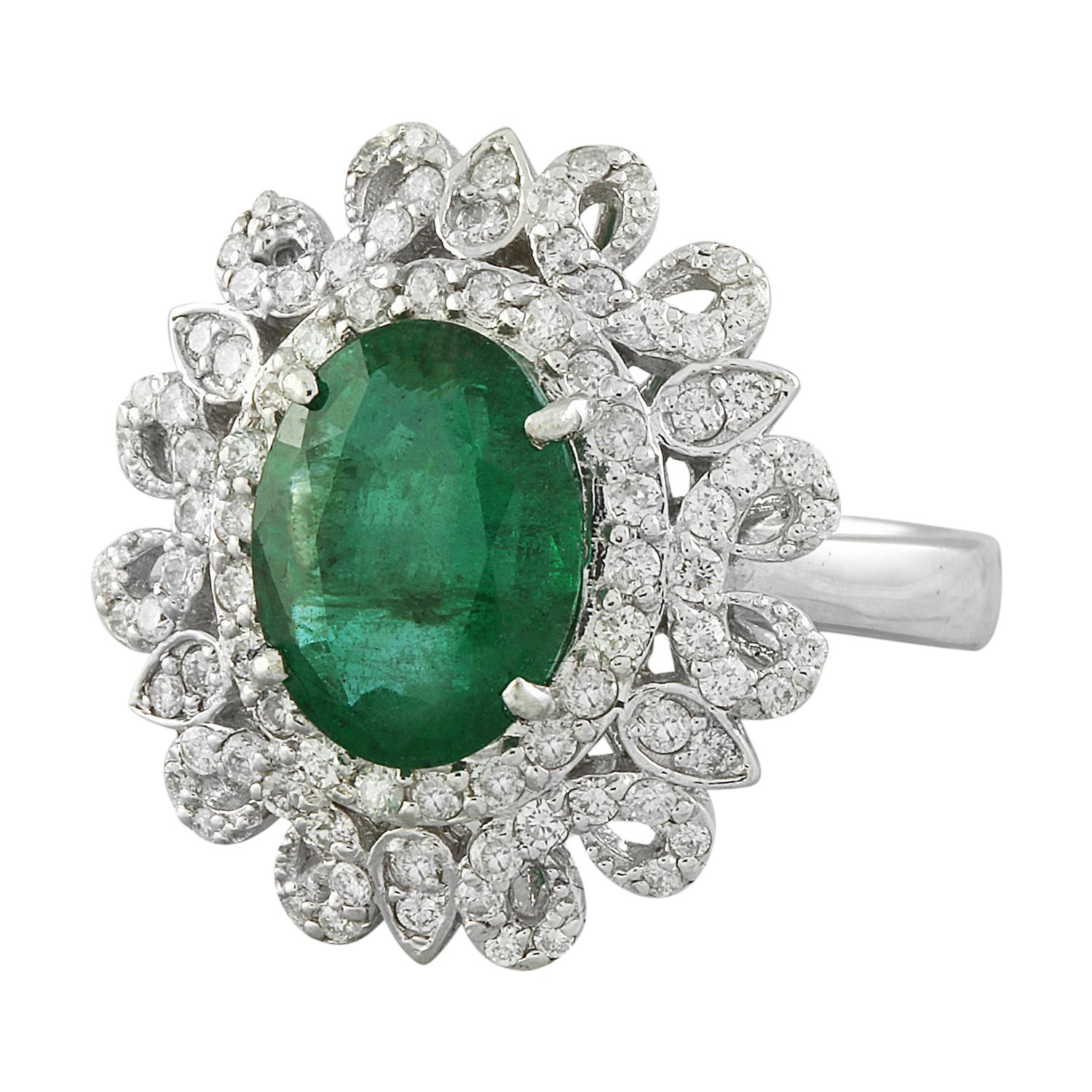 Introducing our exquisite 4.72 Carat Natural Emerald 14K Solid White Gold Diamond Ring. Crafted with precision from stamped 14K solid white gold, this ring boasts a total weight of 7.1 grams, ensuring both quality and longevity. The focal point of
