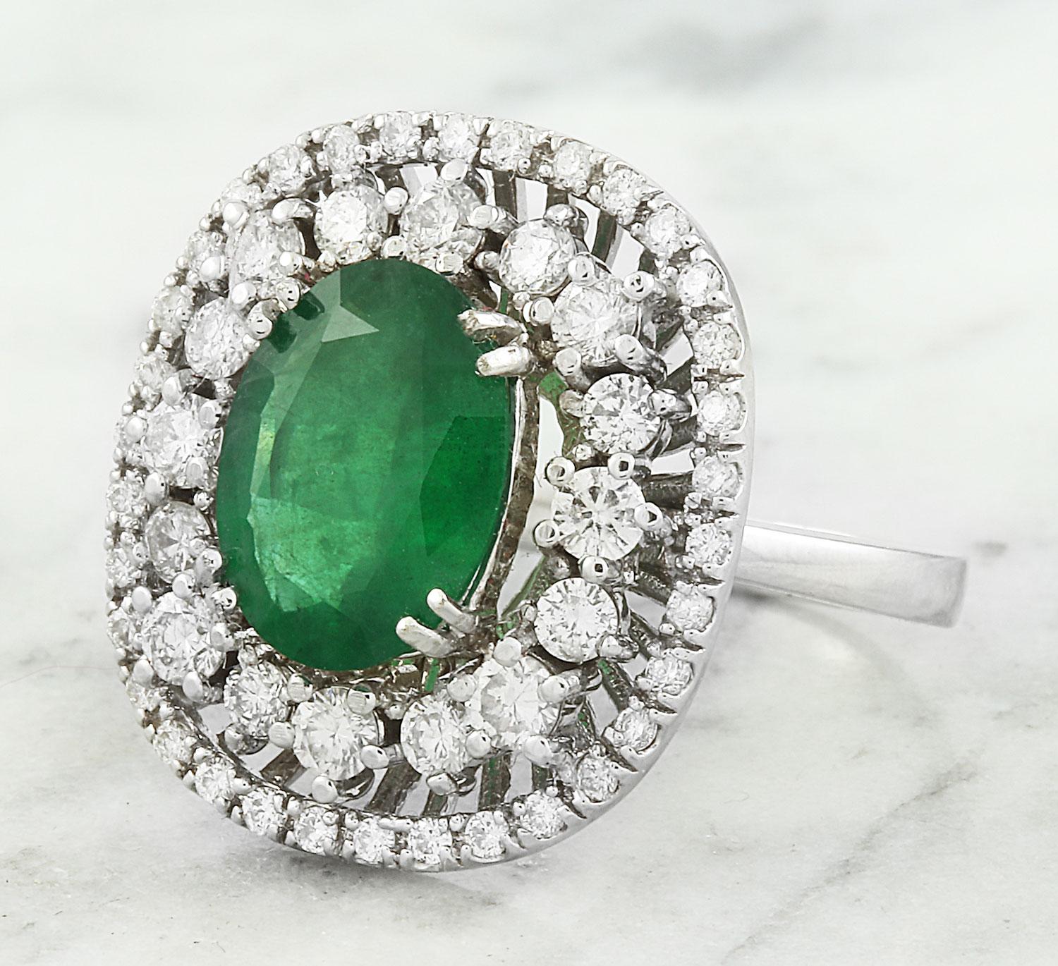 Introducing our exquisite 14K Solid White Gold Diamond Ring featuring a captivating 2.53 Carat Natural Emerald, measuring 11.00x9.00 millimeters. This meticulously crafted ring is adorned with a shimmering 1.20 carat diamond, boasting F-G color and
