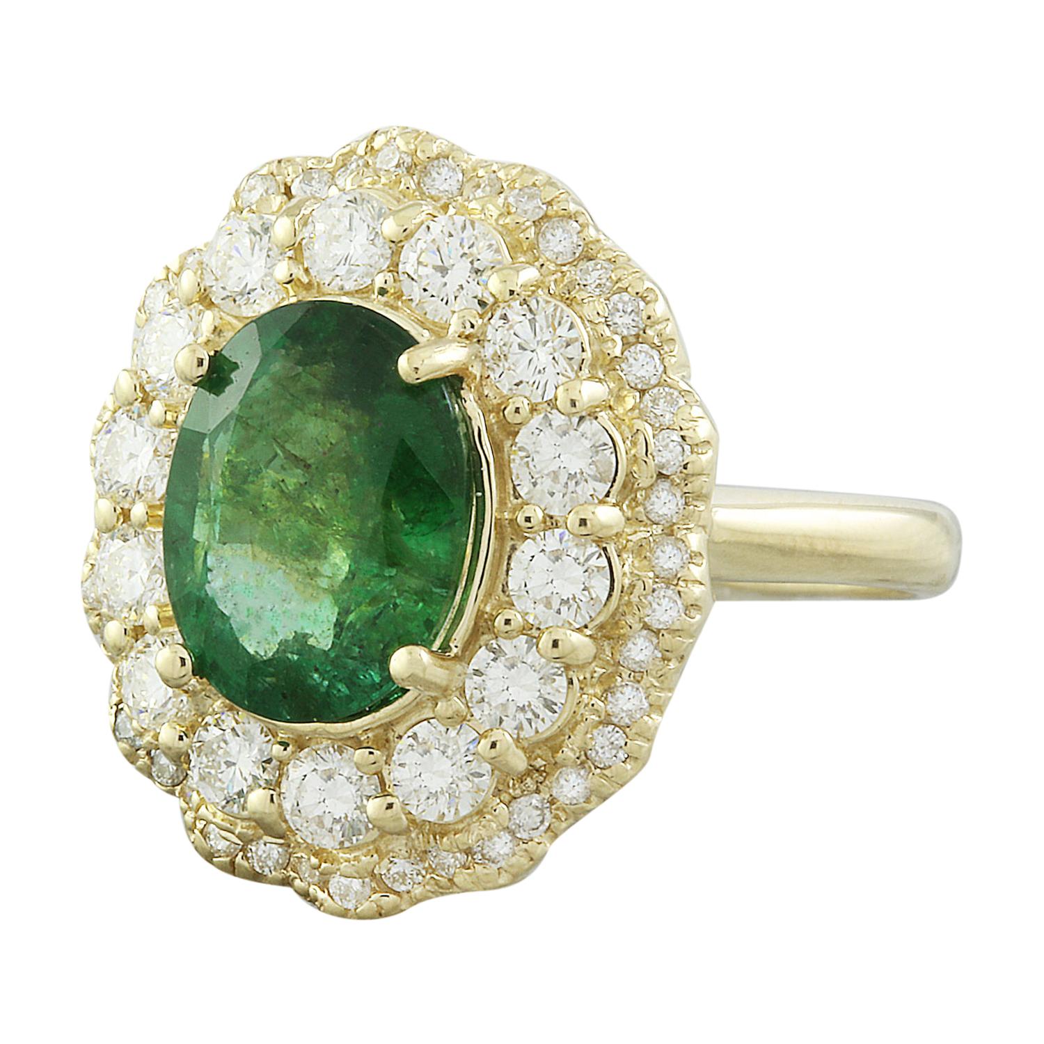 Introducing our stunning 4.84 Carat Natural Emerald 14K Solid Yellow Gold Diamond Ring. Crafted from stamped 14K solid yellow gold, this ring has a total weight of 8 grams, ensuring both quality and durability. The centerpiece features a captivating
