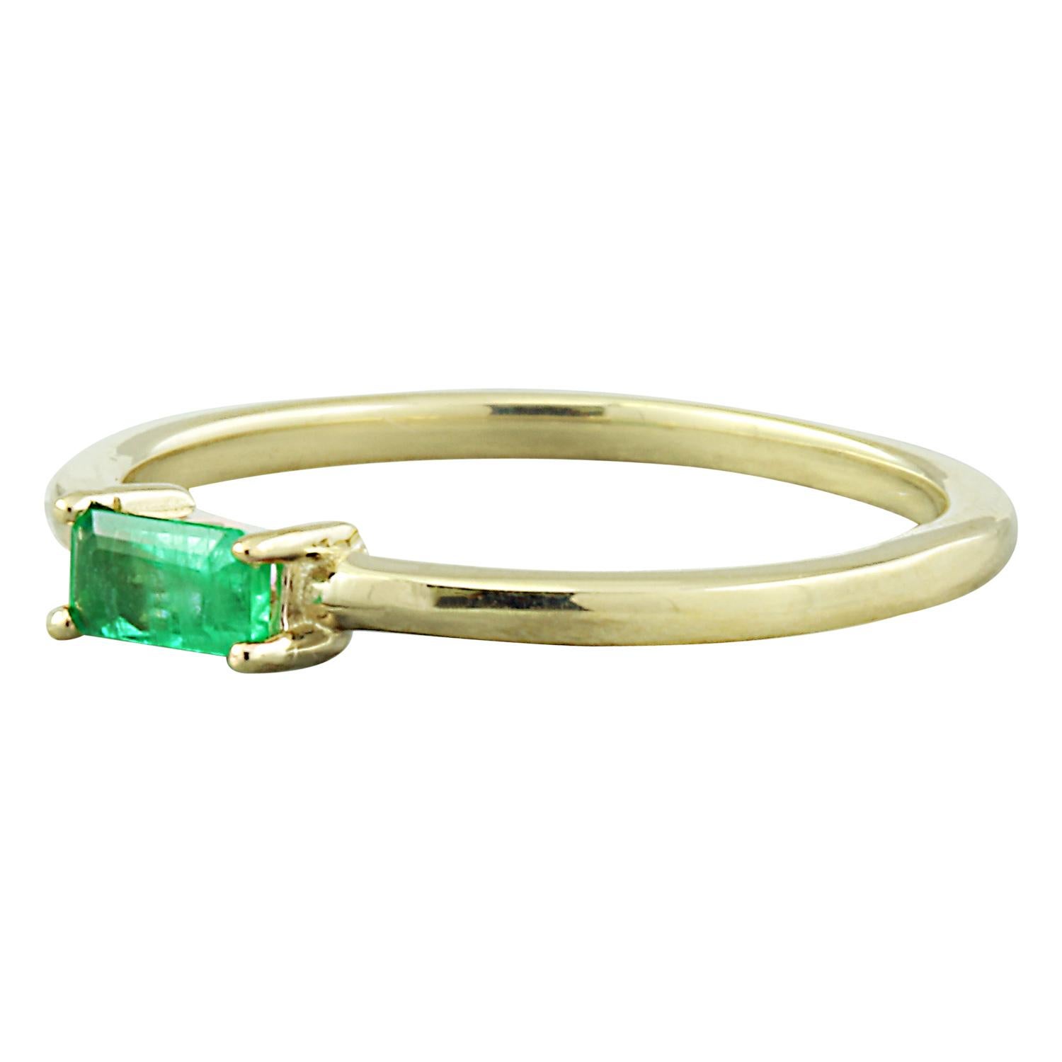 Presenting our delicate 0.25 Carat Natural Emerald Ring, meticulously crafted in luxurious 14K Solid Yellow Gold. This charming piece features a petite emerald weighing 0.25 Carats, with dimensions of 5.00x2.00 millimeters, exuding a vibrant green