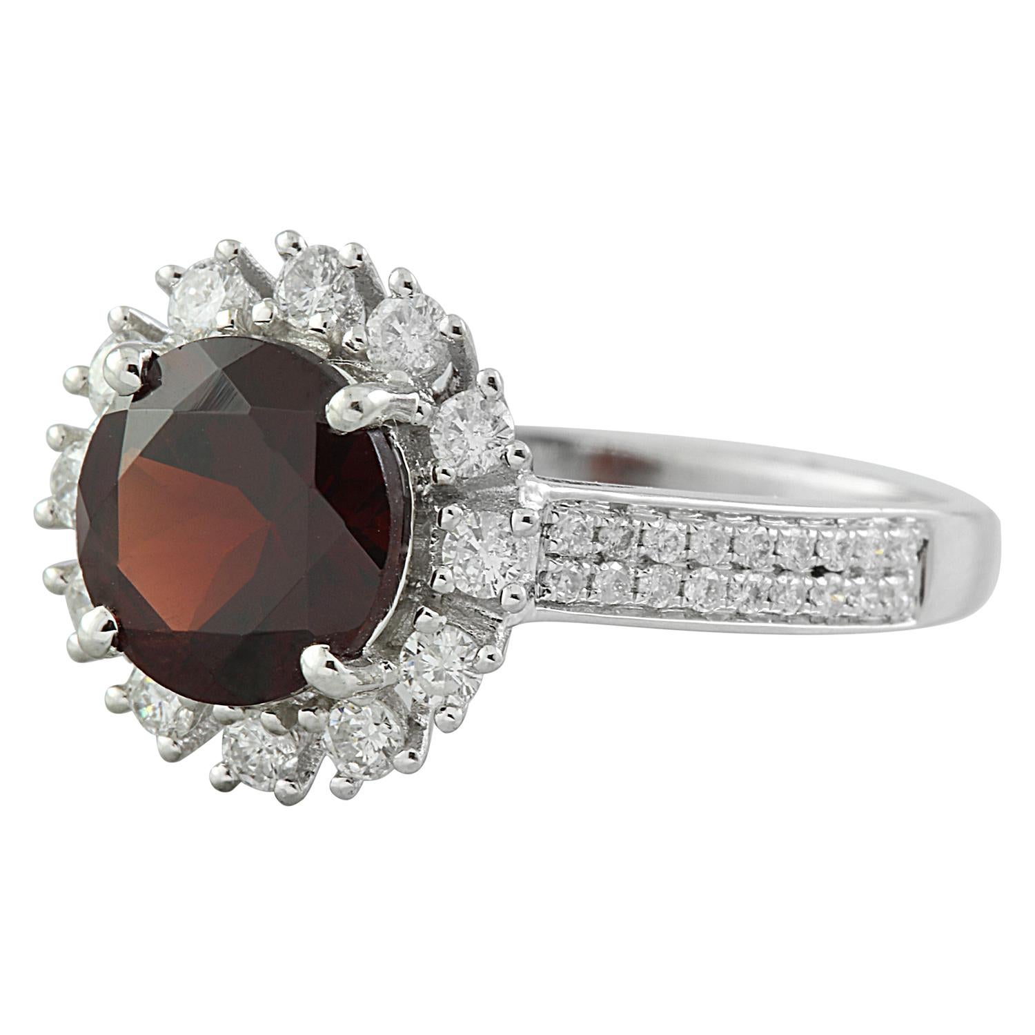 Introducing our exquisite 2.65 Carat Natural Garnet Ring, masterfully crafted in luxurious 14K Solid White Gold. Authenticated with a stamped mark of 14K and weighs a total of 2.8 grams, ensuring both elegance and durability. At its core gleams a