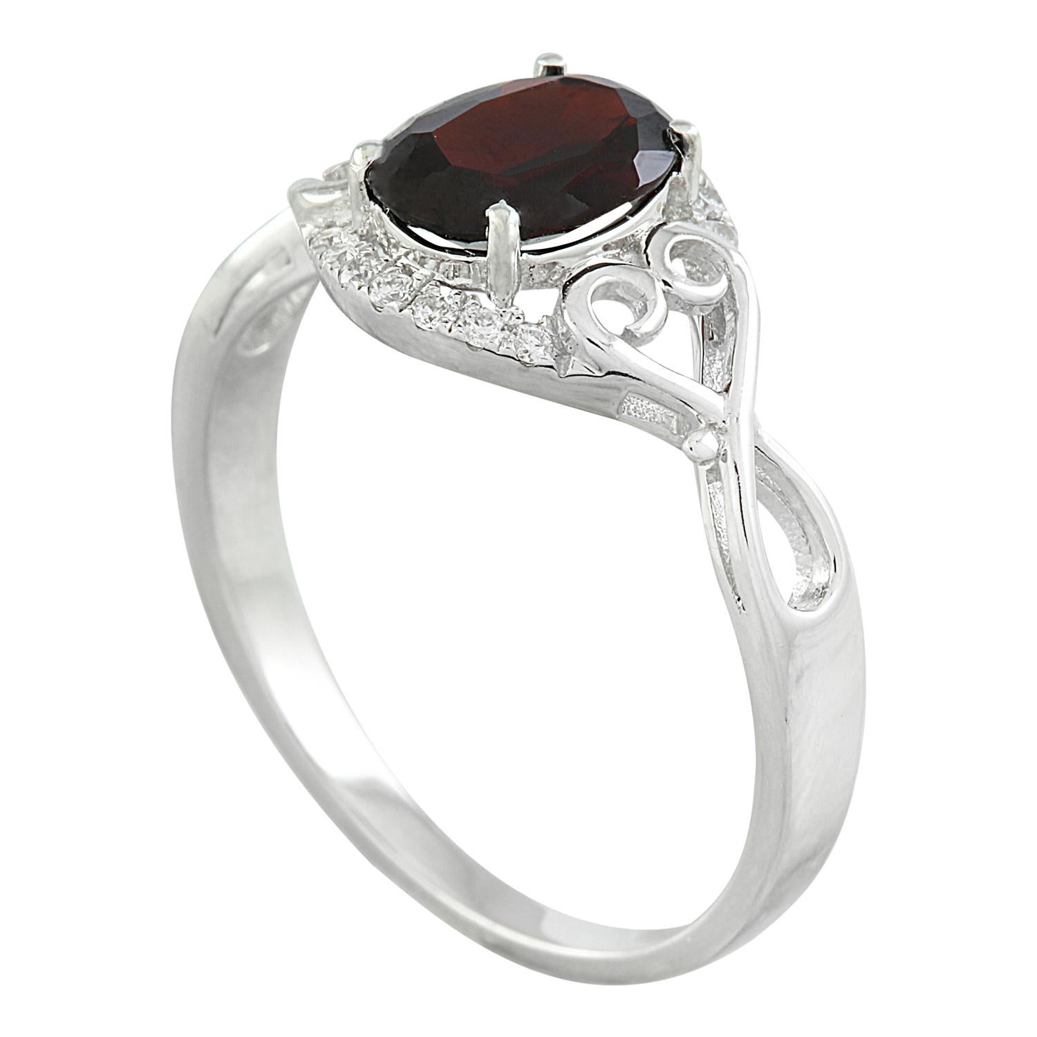 Introducing our stunning 1.27 Carat Natural Garnet Ring, crafted with finesse in elegant 14K Solid White Gold. Authenticated with a stamped mark of 14K, this exquisite ring weighs a total of 2.3 grams, ensuring both grace and durability. At its