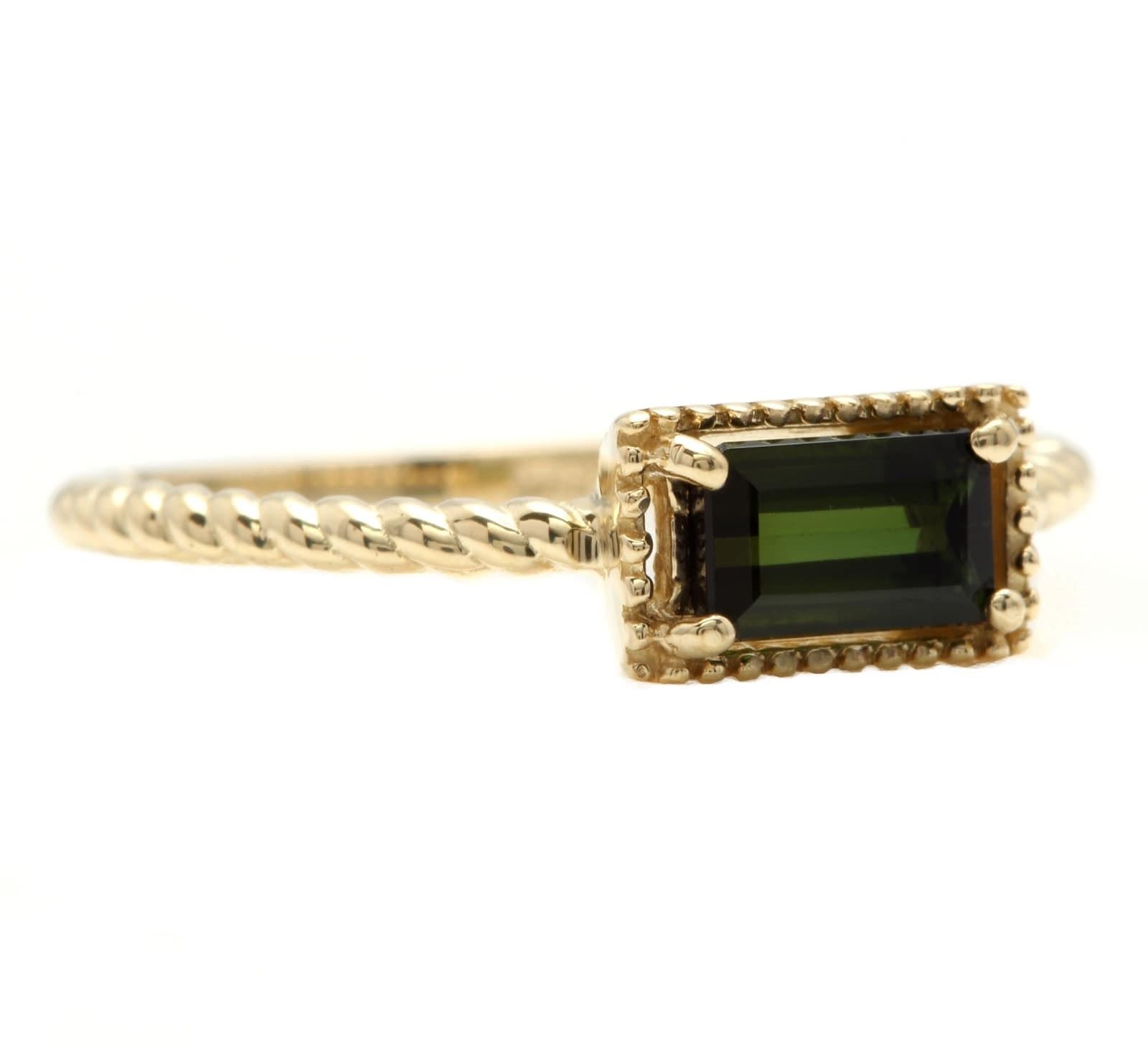 Exquisite Natural Green Tourmaline 14K Solid Yellow Gold Ring

Total Natural Green Tourmaline Weight is: Approx. 0.60 Carats 

Tourmaline  Measures Approx.  6.00 x 3.70mm

Ring size: 6.75 (free re-sizing available)

Ring total weight: Approx. 1.6