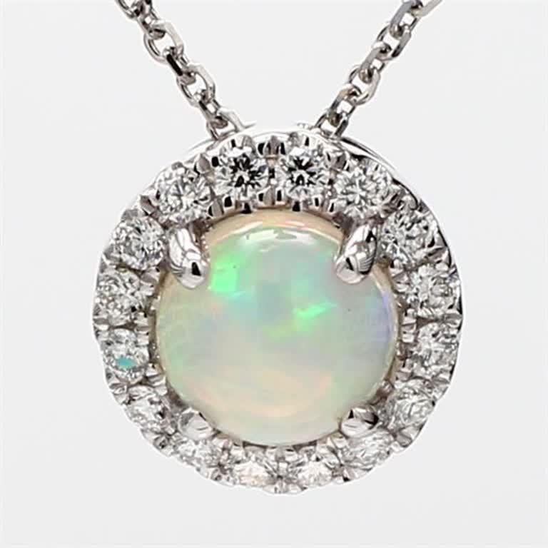 .91cts round opal surrounded by round white diamonds. This pendant is designed to be in a simple setting. Can be used as a drop pendant or in addition to your collection of jewels.

Total Weight: 1.16cts

Length x Width: 10.8 x 10.8mm

Centerstone