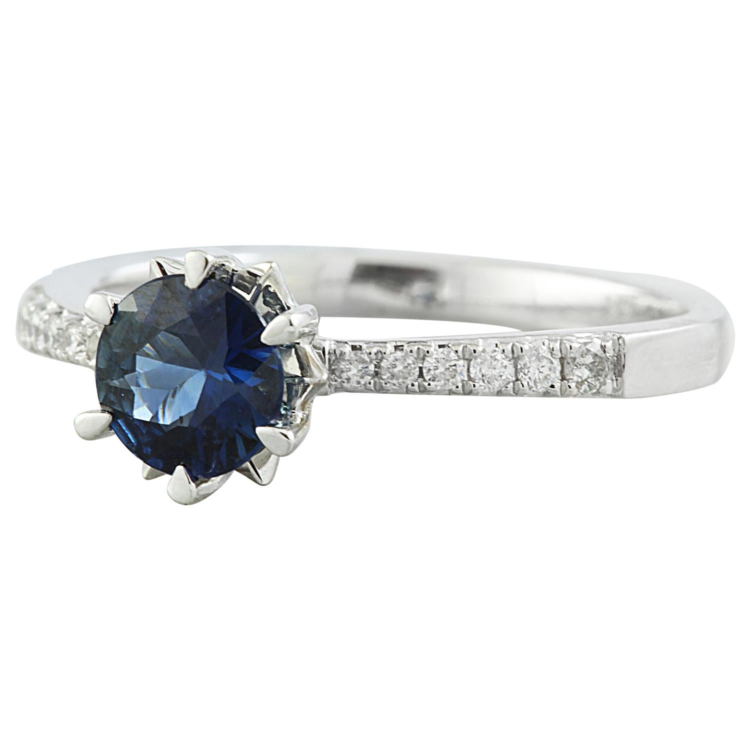 Introducing our exquisite 1.18 Carat Natural Sapphire 14K Solid White Gold Diamond Ring.
This ring boasts 14K Solid White Gold and weighs a total of 2.2 grams.
The focal point of this stunning piece is a natural sapphire weighing 1.05 carats,