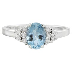 Exquise bague en or blanc massif 14 carats avec topaze bleu ciel et diamants