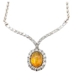 Collier exquis d'opales et de diamants en or blanc 18 carats