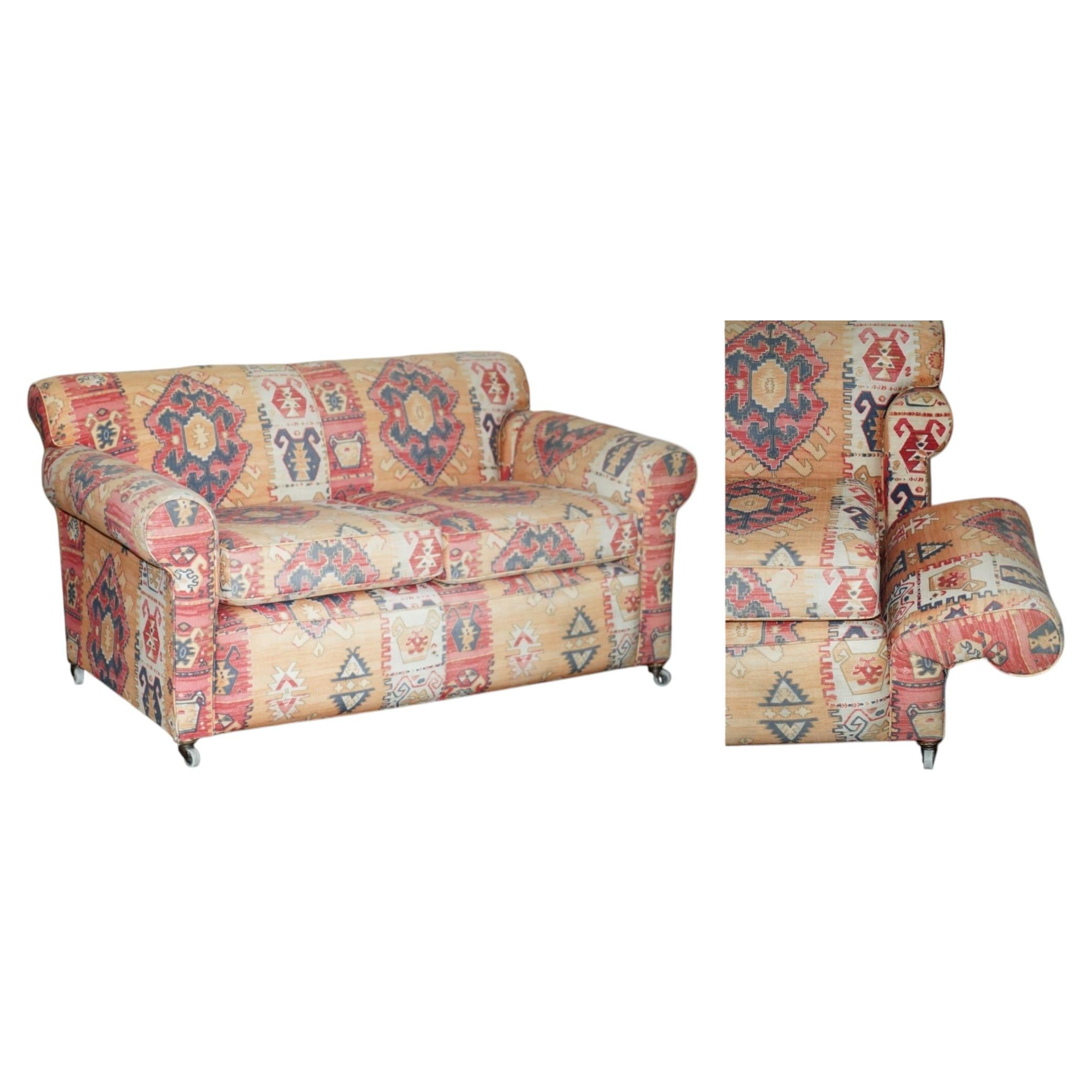 What is a drop arm sofa for?