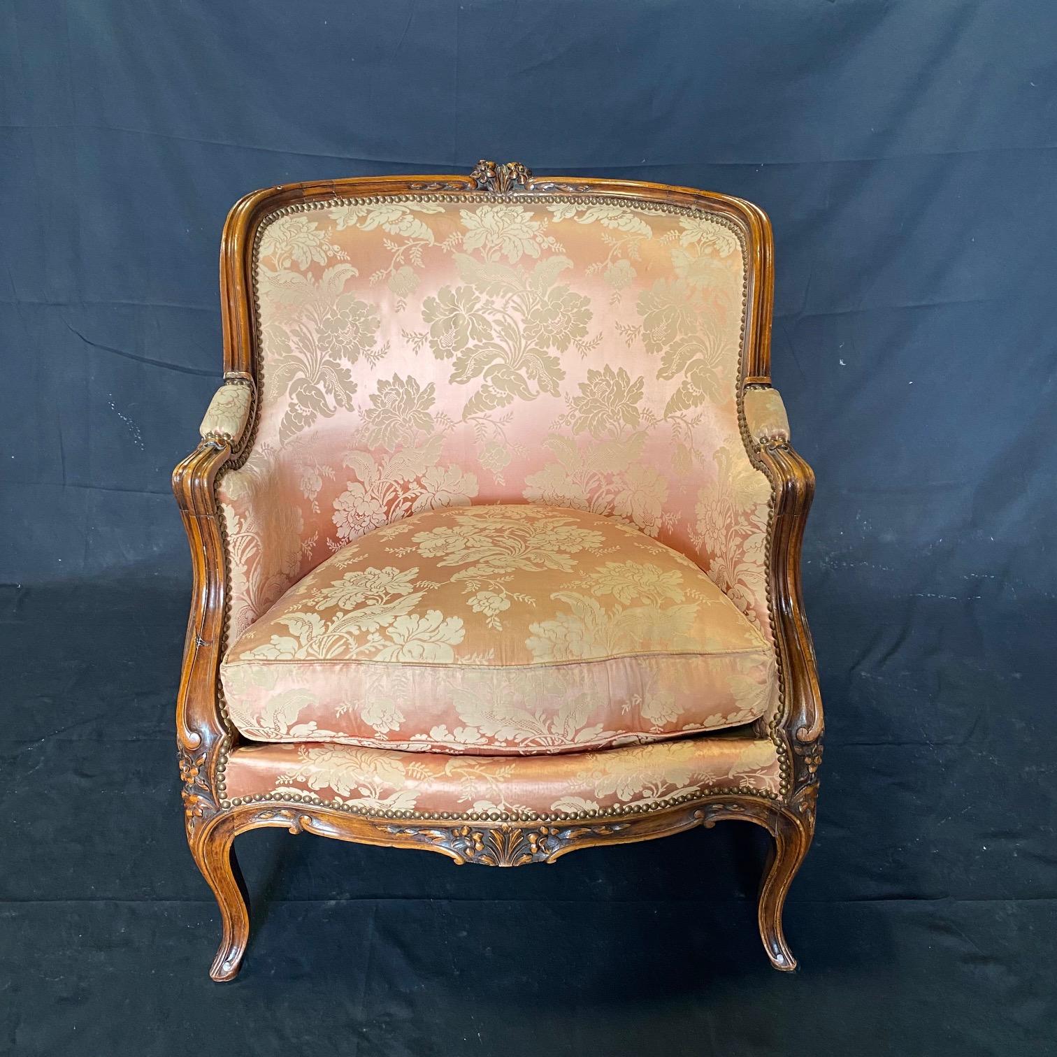 French Exquisite Pair of Antique Louis XV Carved Walnut Bergere Chairs or Club Chairs  For Sale