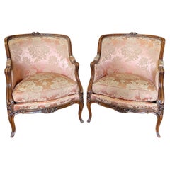 Exquisite Pair of Antique Louis XV Carved Walnut Bergere Chairs or Club Chairs