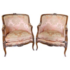 Exquisite Pair of Antique Louis XV Carved Walnut Bergere Chairs or Club Chairs 