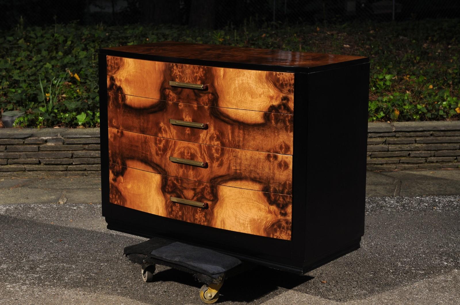 A magnificent pair of Art Deco commodes from a rare series designed by the esteemed Donald Deskey for Widdicomb, circa 1935. This Stunning pair is unique on the World market. Elegant mahogany case construction expertly finished in black lacquer.