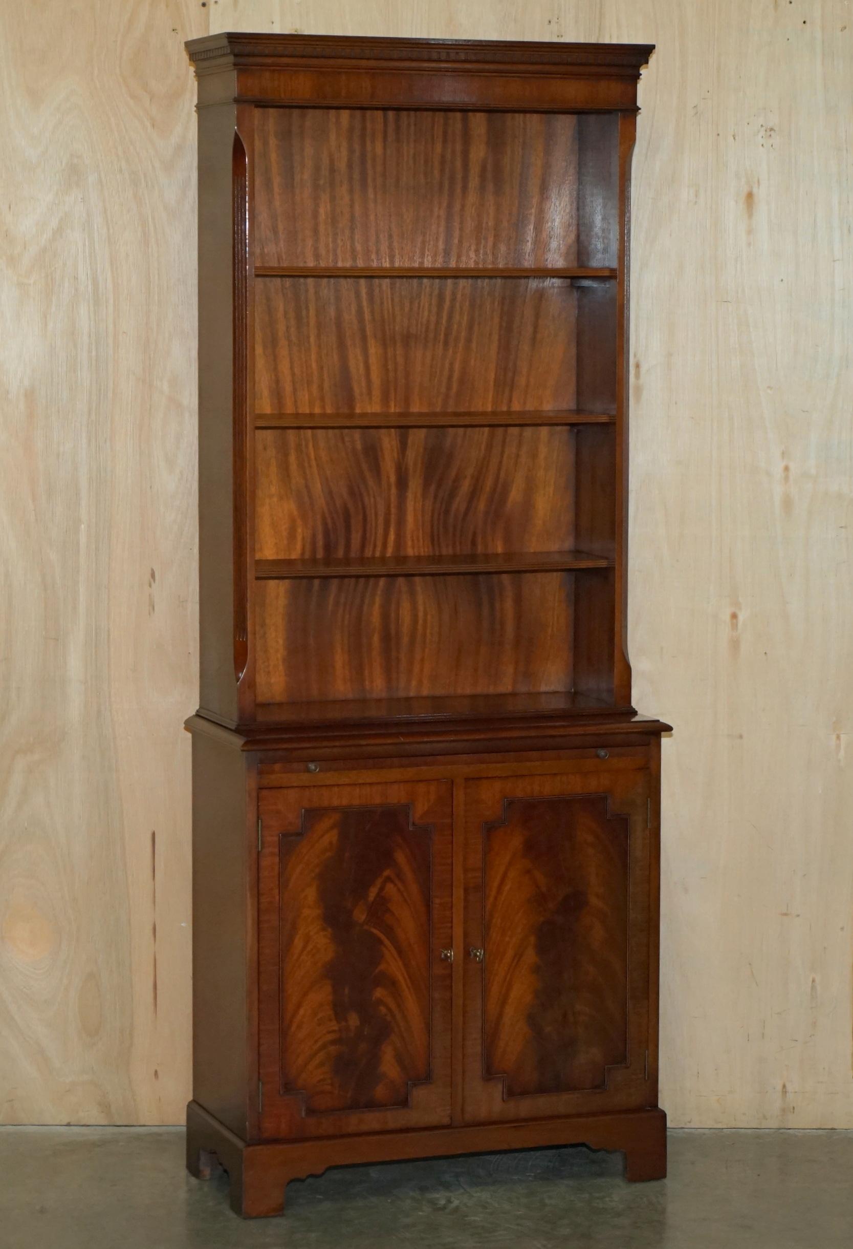 Royal House Antiques

Royal House Antiques is delighted to offer for sale this absolutely stunning pair of vintage flamed Mahogany bookcases with cupboard bases and butlers slip serving shelves ideally suited as drinks cabinets 

Please note the