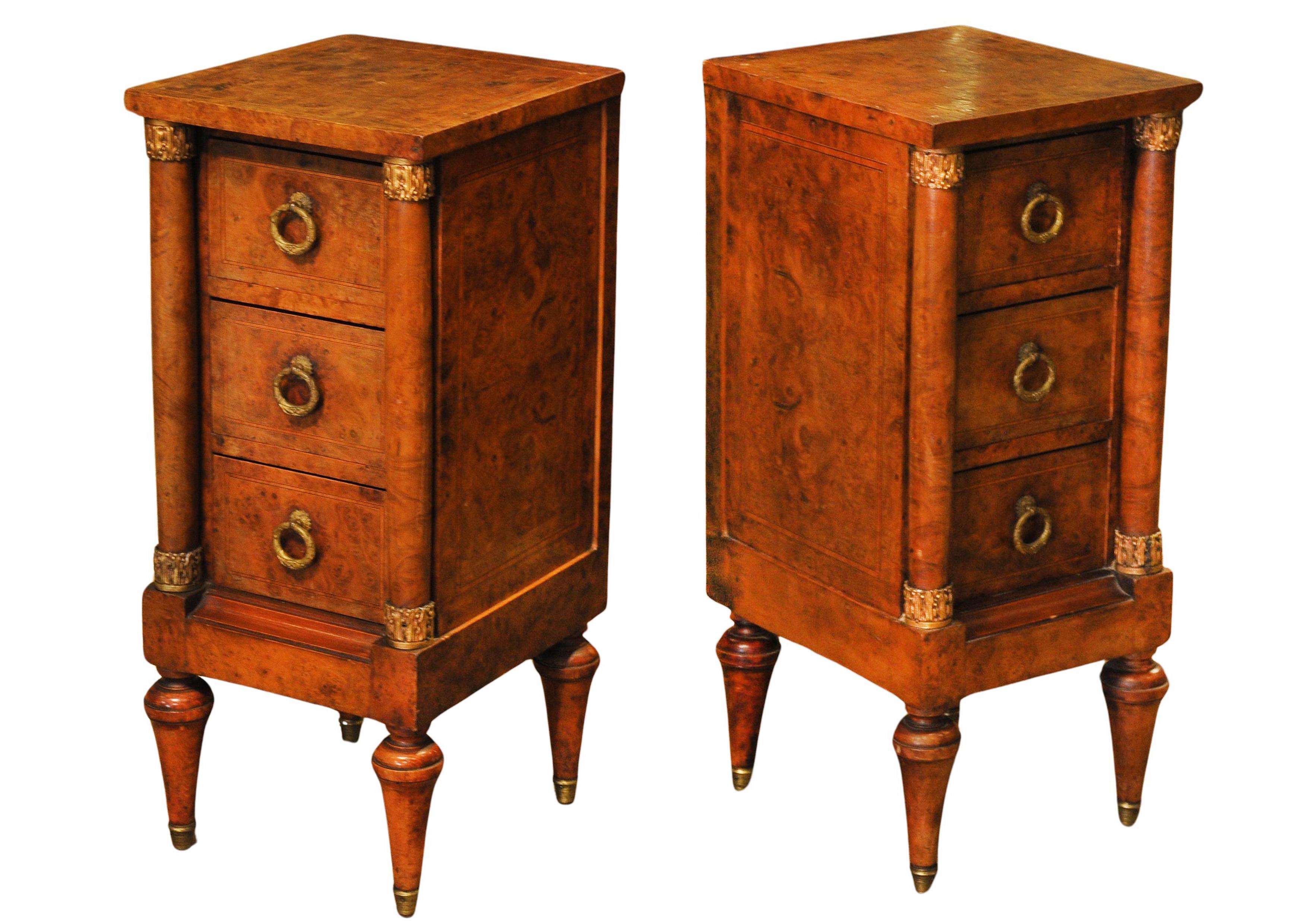 A Pair of French Empire Design Figured Walnut Three Drawer Nightstand Chests With Mounted Gilt 

Provenance: From an Establishment on Belgrave Square London see images7

Known to be one of the most prestigious addresses in the country, Belgrave