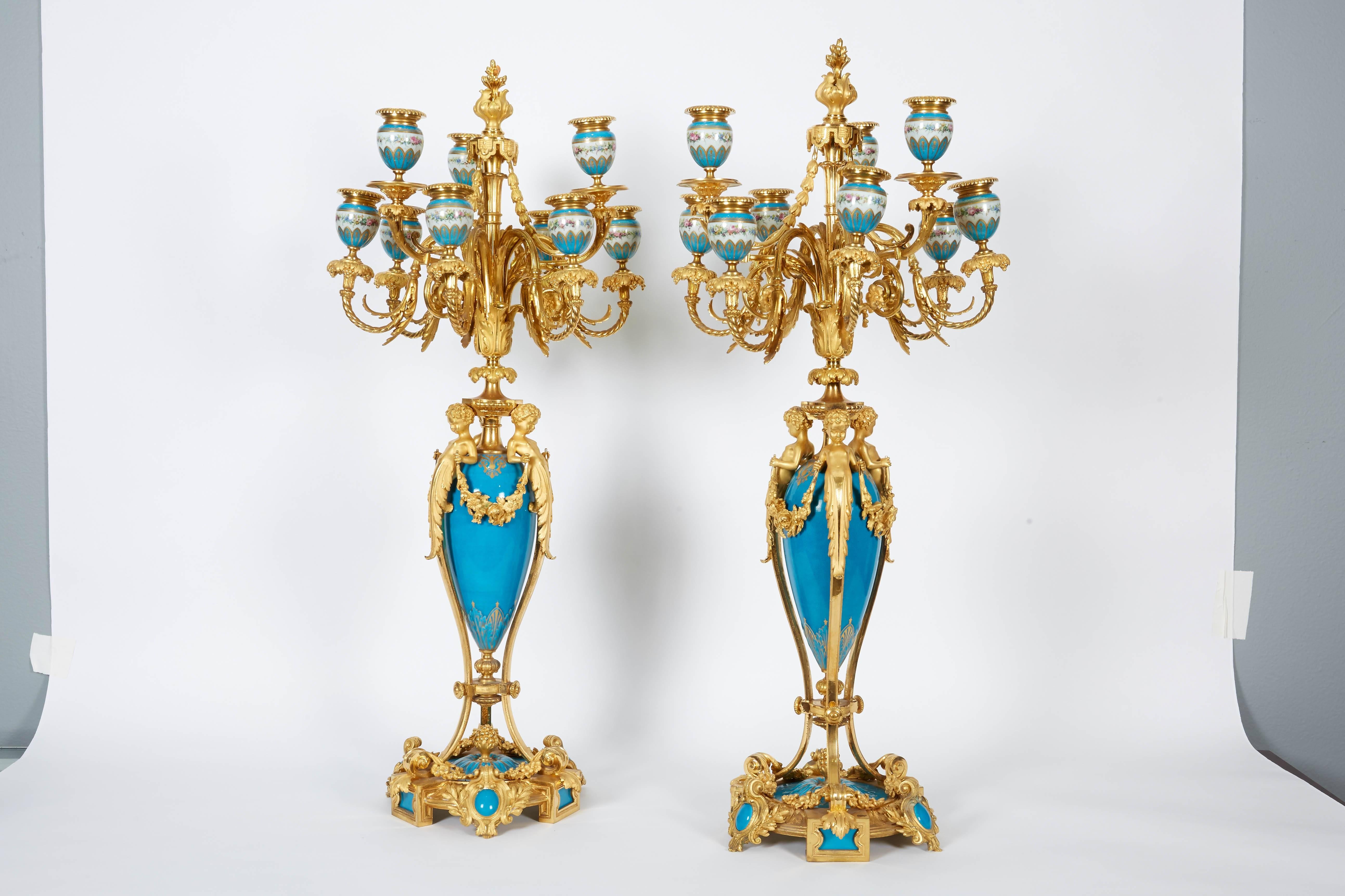 Exquisite pair of French ormolu bronze-mounted and turquoise sevres porcelain nine-light candelabra, circa 1880.

The quality of this pair is jewel like and attributed to Alfred Beurdeley Paris. 

Nine hand-painted porcelain candle-cups.