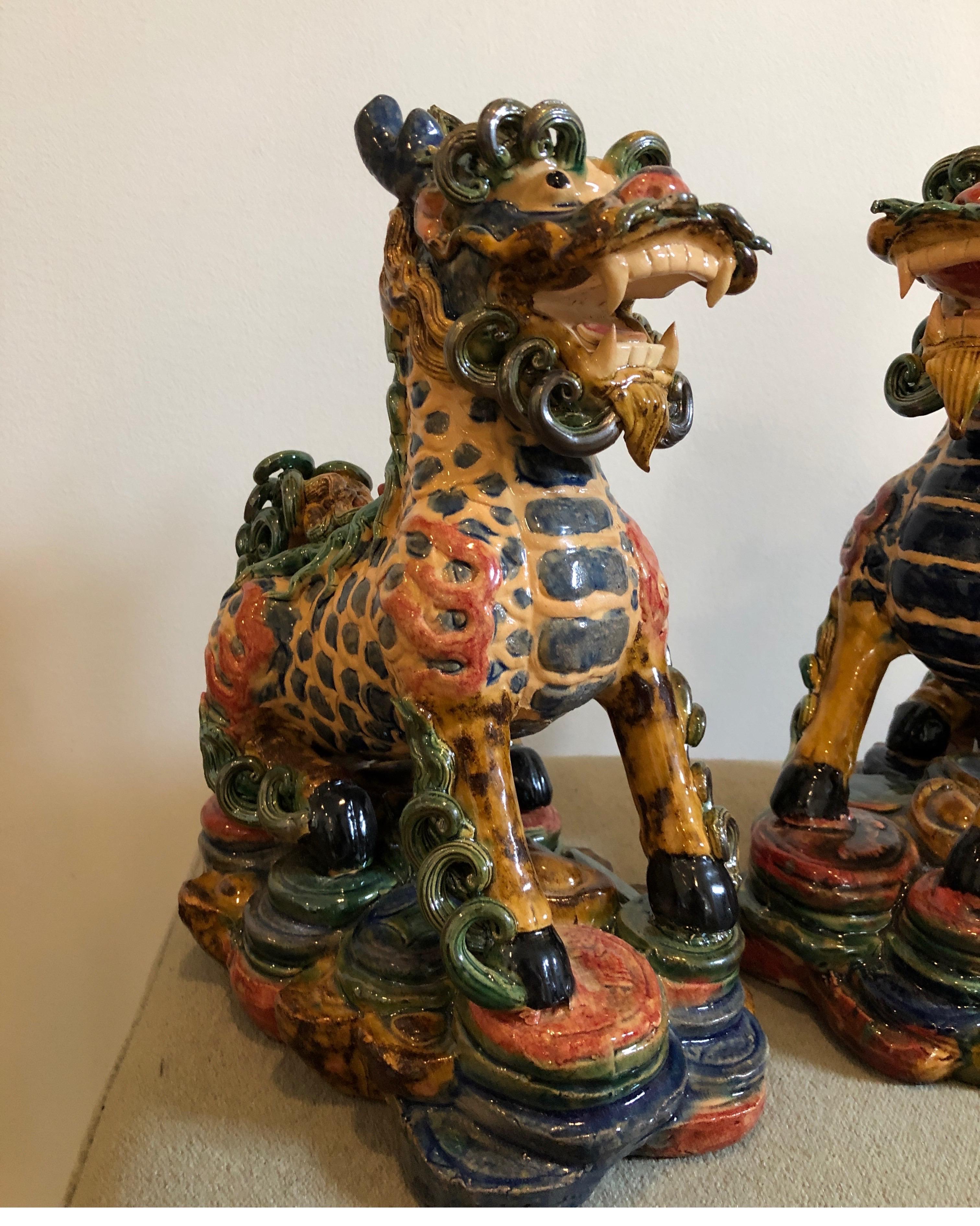 Qing Exquisite Pair of Glazed Porcelain Foo Dogs For Sale