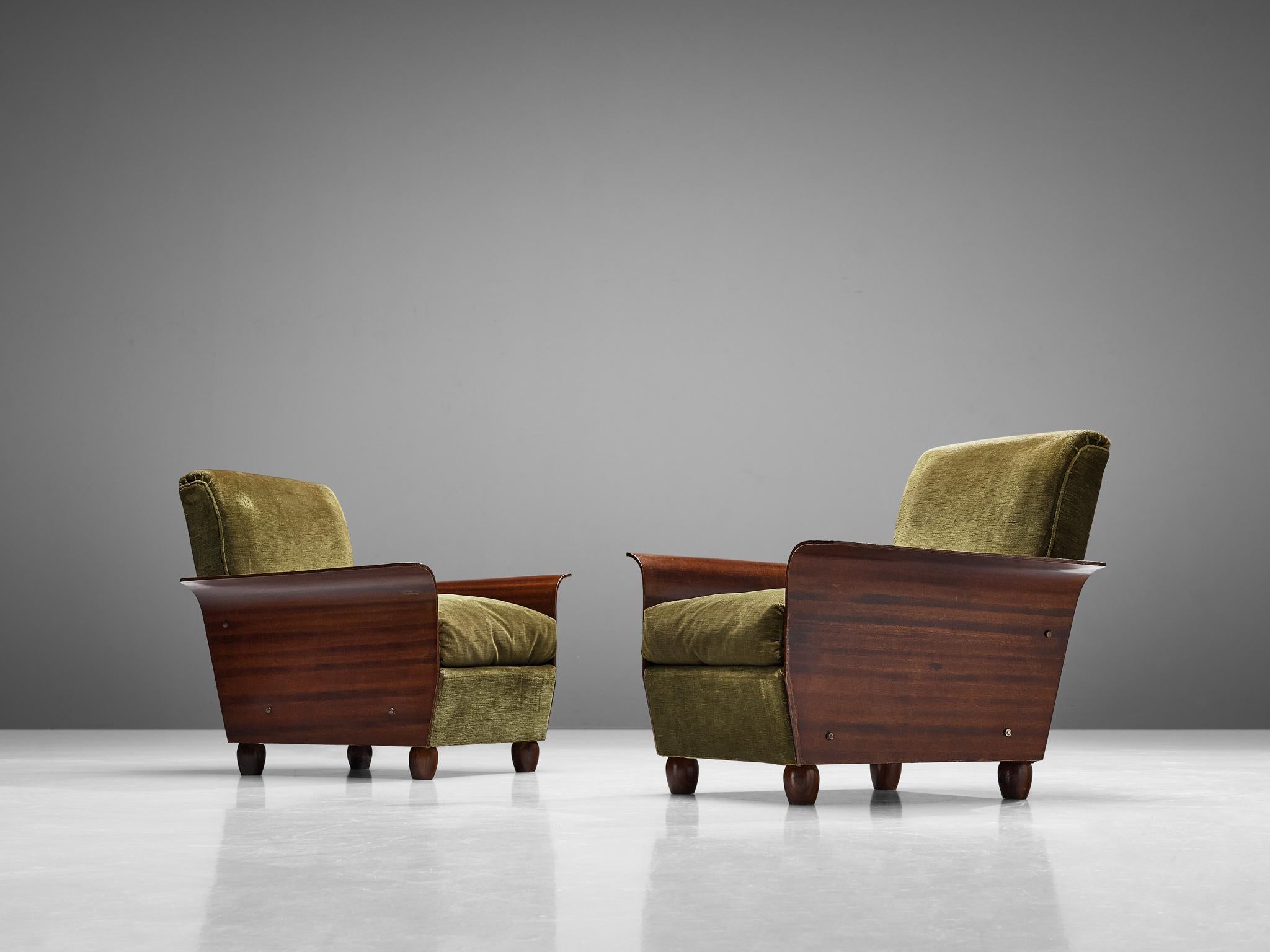 Pair of lounge chairs, velvet fabric, mahogany, Italy, 1950s

This beautifully shaped pair of lounge chairs of Italian origin comes with an expressive forest green colored upholstery that is pleasing to the eyes. This particular piece of furniture