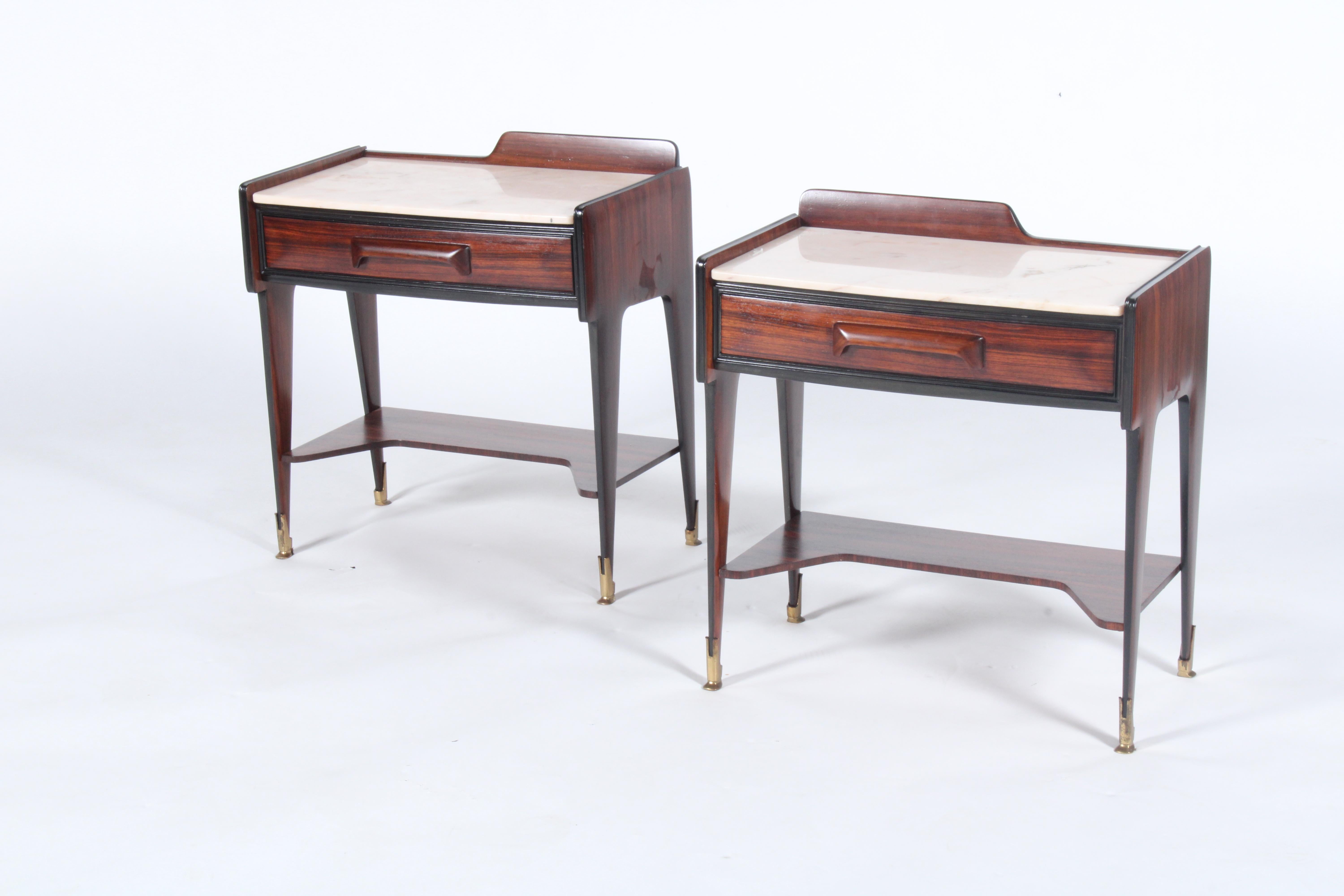 Attributed to Vittorio Dassi this stunning pair of of original mid century Italian bedside tables are in rosewood with ebonised and brass detailing along with beautiful original marble tops. Storage is offered in the form of a pull out drawer and