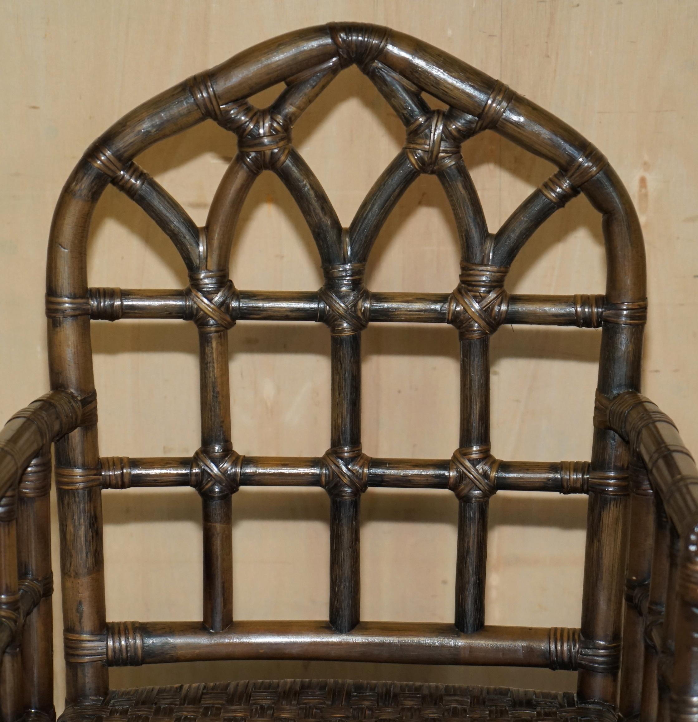 English EXQUISITE PAIR OF MID CENTURY MCGUIRE RATTAN GOTHIC CATHEDRAL BACK ARMCHAIRs For Sale