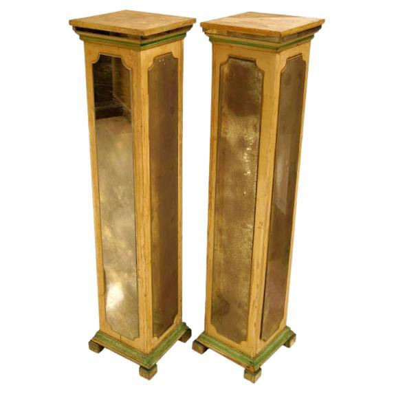 Exquisite pair of mirrored pedestal stands in square form in manner of Maison Jansen.  All four sides with faded design mirrors.

From its beginnings Maison Jansen combined traditional furnishings with influences of new trends including
