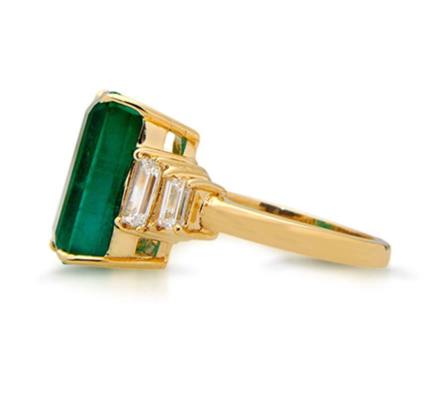 EXQUISITE PANJSHIR EMERALD RING This superb example of an emerald is enriched by a warm gold and diamond setting Item: # 00836 Metal: 18k Y Lab: Gia Color Weight: 7.82 ct. Diamond Weight: 1.07 ct.
