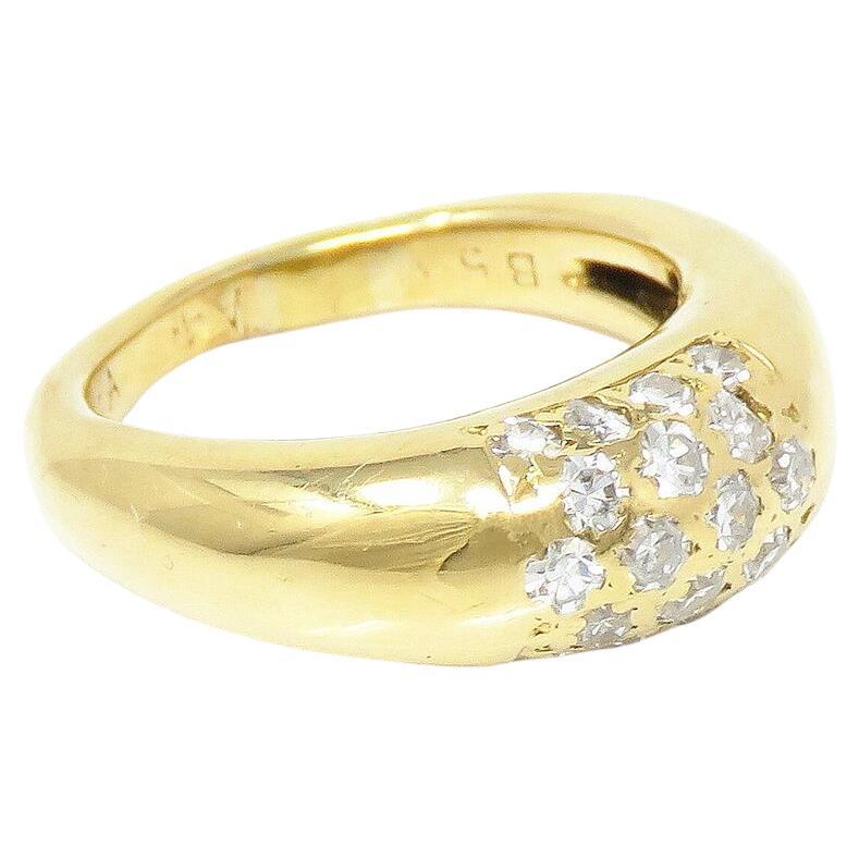 Presenting a stunning Van Cleef & Arpels ring, featuring approximately 0.6 carats total weight of dazzling diamonds, predominantly in the E-F color range and VVS clarity. This exquisite piece, marked 