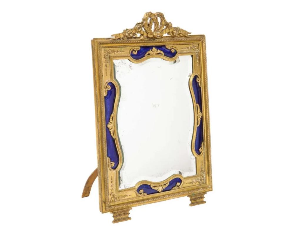 Exquisite quality French ormolu bronze and blue guilloche enamel mirror frame, 19th century.

Very good quality, no damage to the enamel.

Measures: Frame: 17