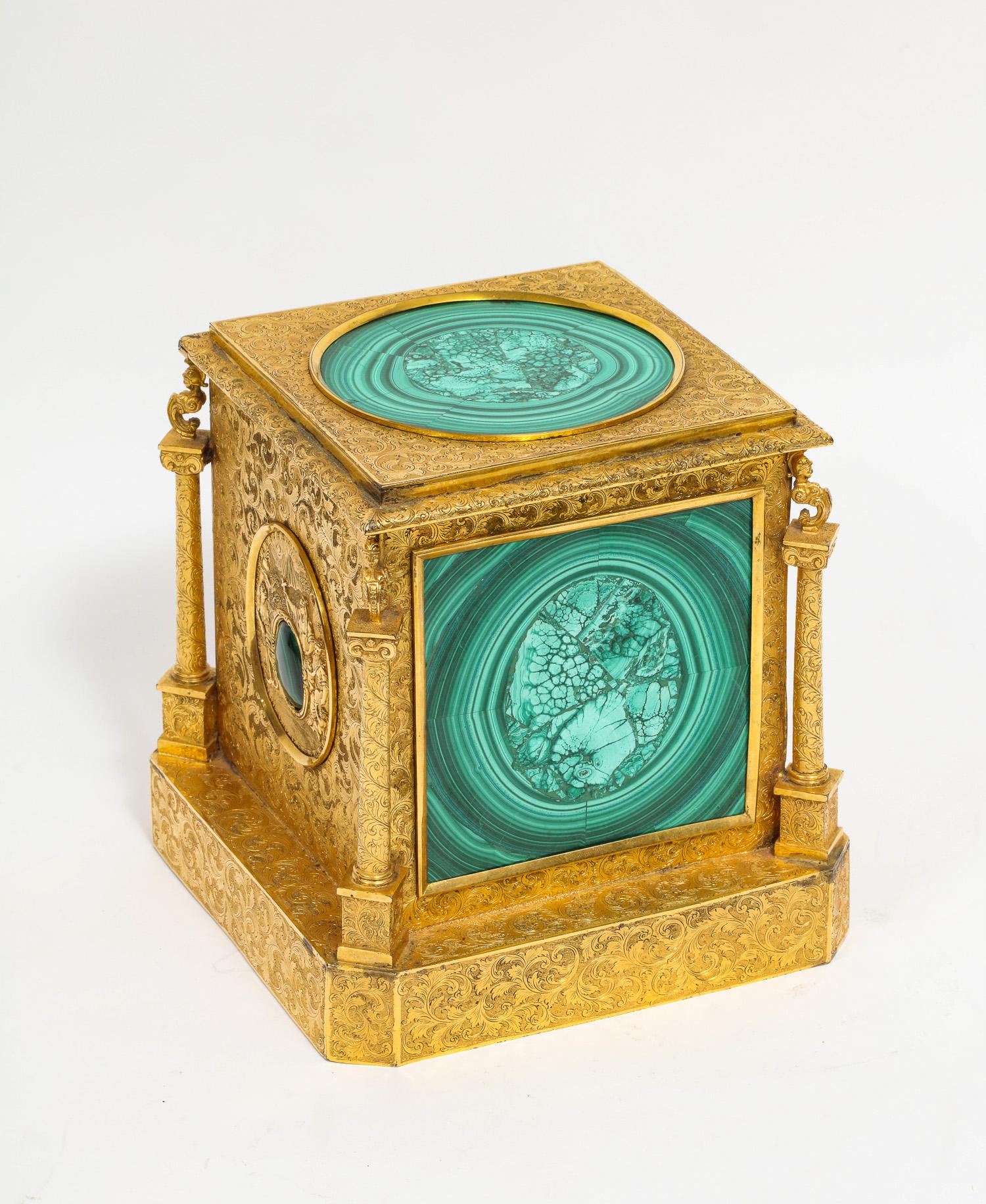 Exquisite quality Napoleon III engraved ormolu bronze and malachite perfume or scent bottle box or case,
Paris, circa 1870

The hinged lid enclosing the original - four aquamarine blue cut glass scent perfume bottles with stoppers, all in mint