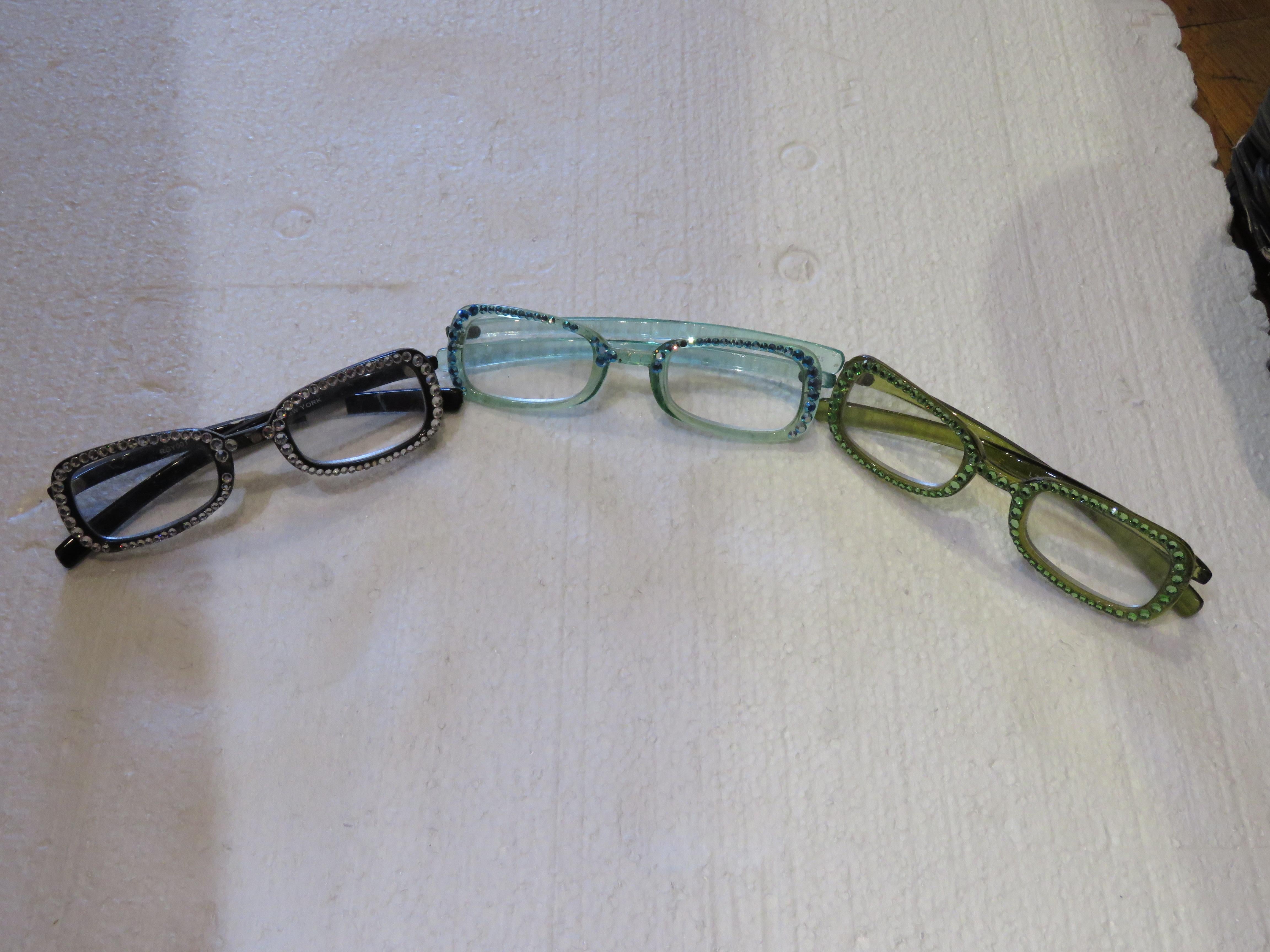 The Following Item that we are offering is a Set of 3 Magnificent and Exquisite Rare Colorful Reading Glasses. Outstandingly done with Magnificent Colors and Detail and adorned with Swarovski Crystals. From a Several Million Dollars New York Estate
