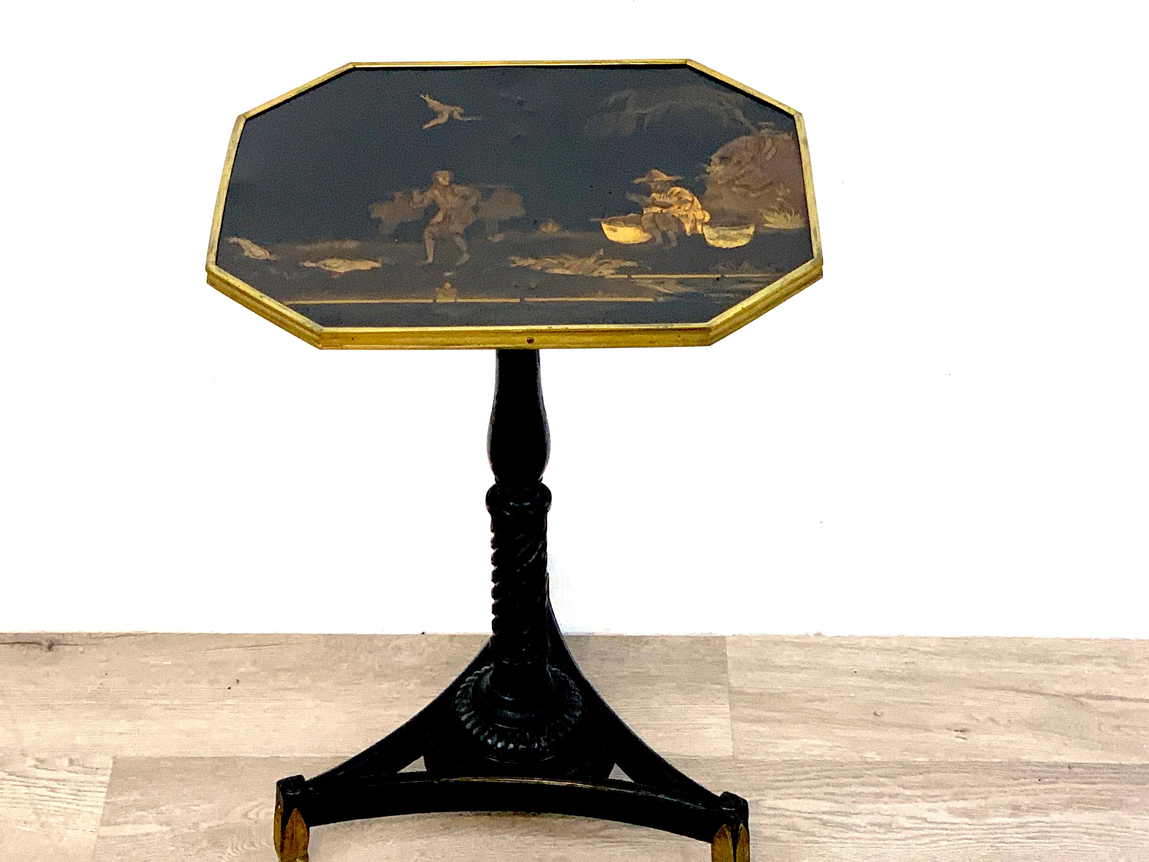 Exquisite Regency Chinoiserie side table, The octagonal finely decorated landscape top, with bronze mounts, raised on a turned column tripartite 13.5