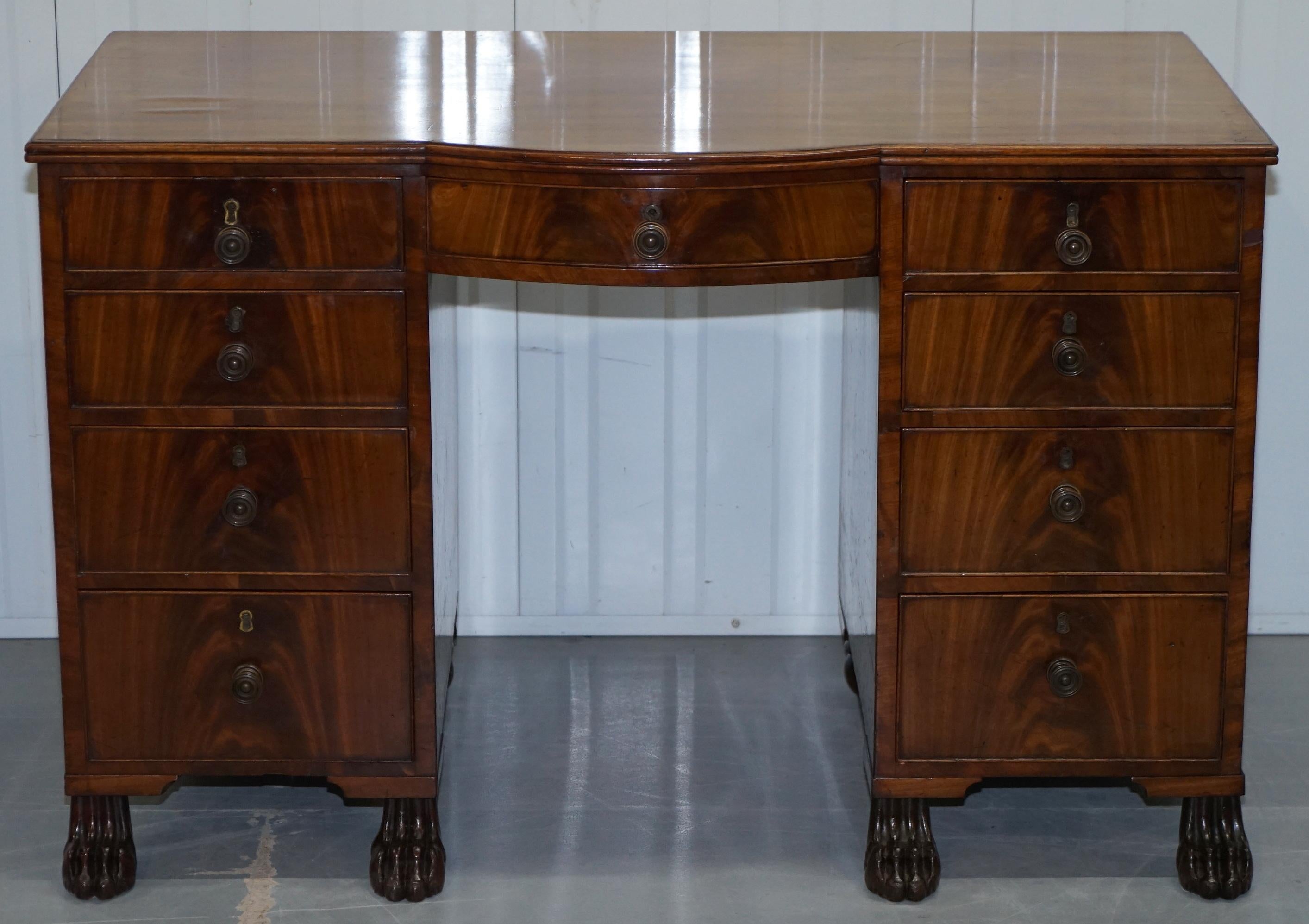 We are delighted to offer for sale this lovely original circa 1815 Regency bow front kneehole partner desk in solid mahogany with Lion hairy paw feet

A good looking and well-made piece, the timber patina is glorious, the Lion hairy paw feet
