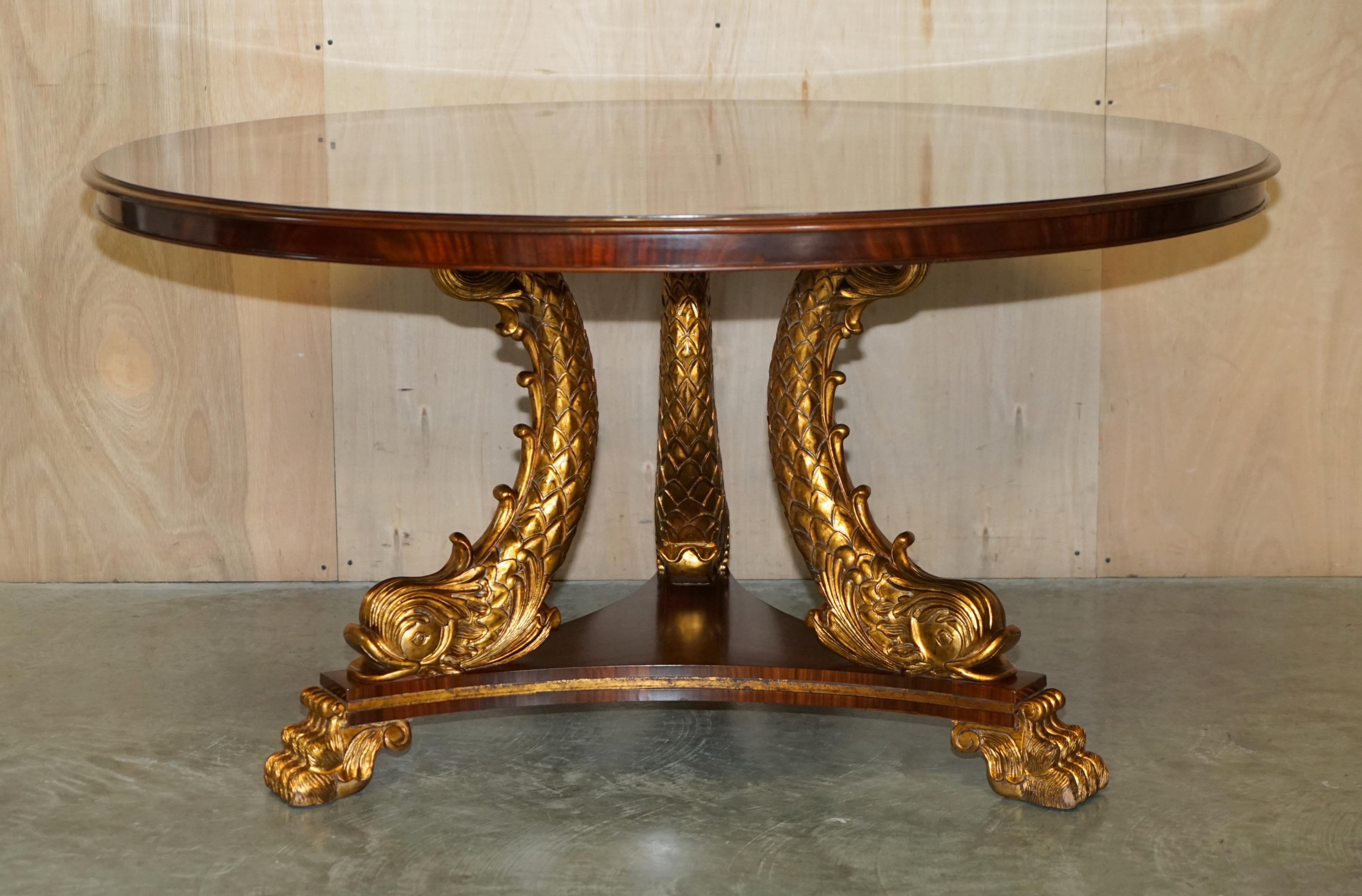 We are delighted to offer for sale this absolutely exquisite, Regency style, large round dining or huge centre table with Dolphin base that has been beautifully gilded and flamed mahogany top 

Please note the delivery fee listed is just a guide,