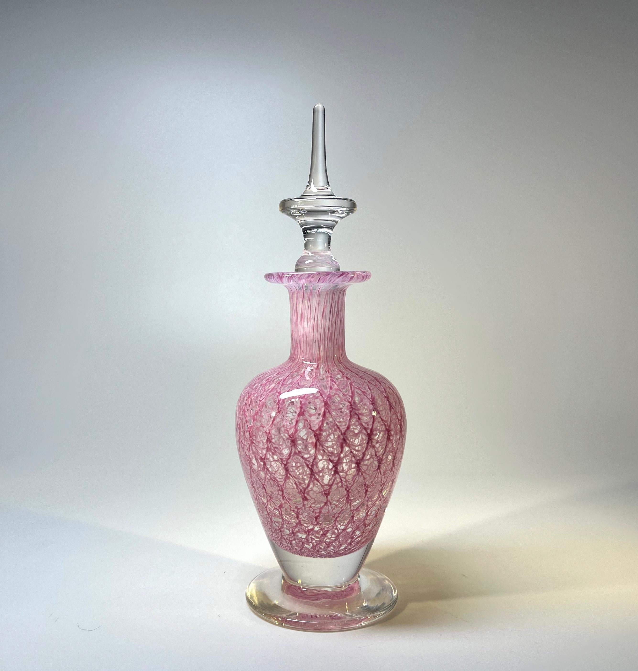 Absolutely exquisite English hand blown crystal perfume bottle from the 1980's.
A delightful and delicate Rose Pink lattice design with a clear crystal stopper.
Created by Teign Valley Glass of Devon, England
Signed TVG to the base
Circa 1980's