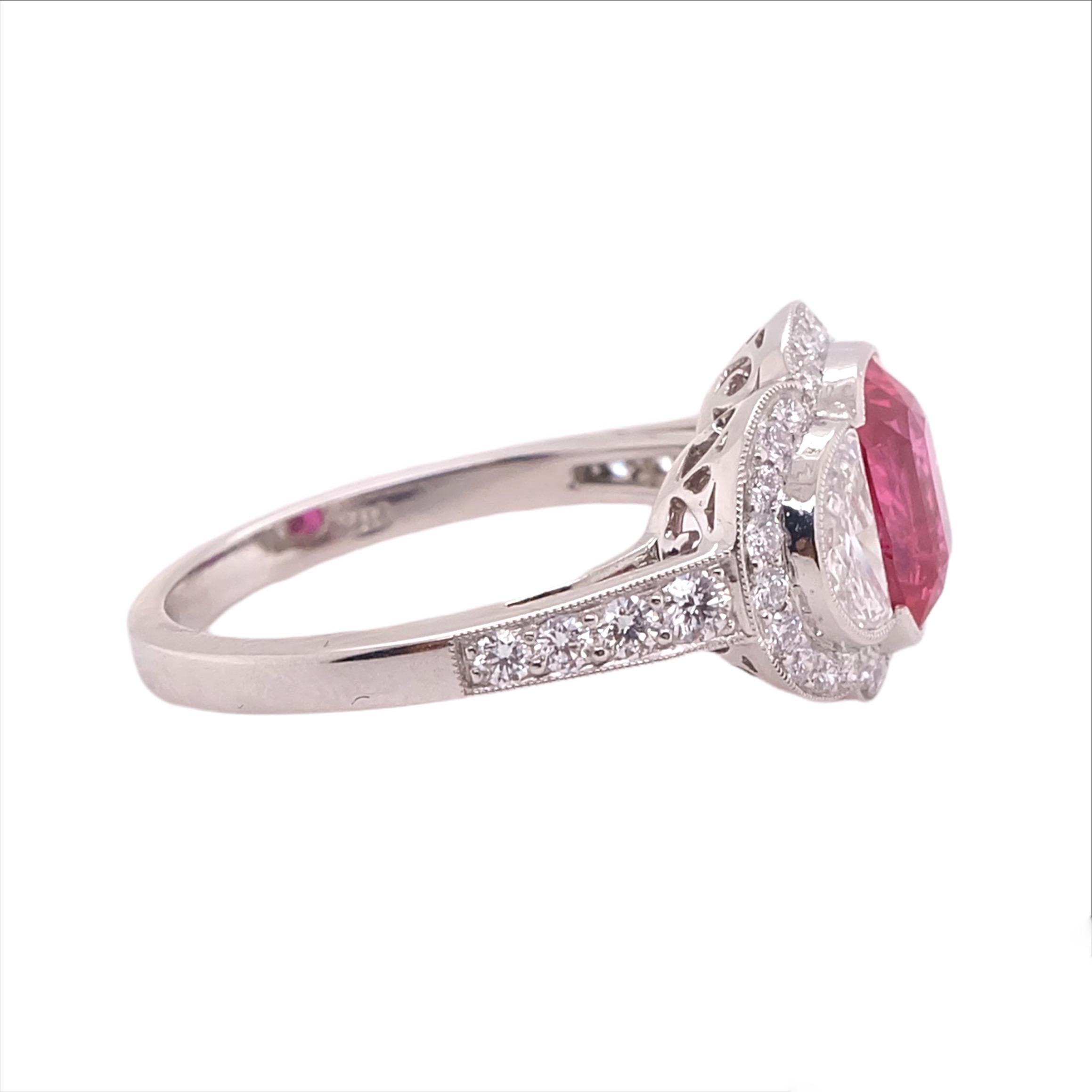 GIA certified 2.06 carat Ruby stone with two 0.68 carat Diamonds on the side, smaller diamonds at 0.37 carats