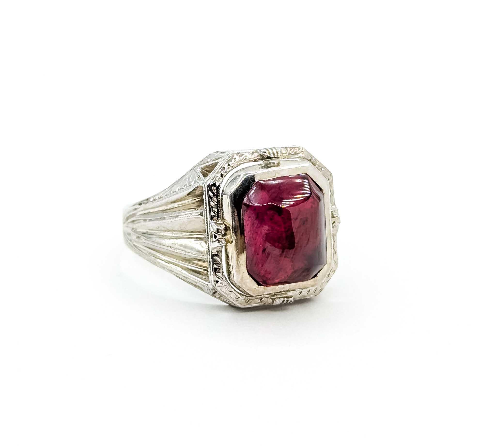 Exquisite Ruby Cabochon and White Gold Ring

Introducing this exquisite ring, crafted in 14k white gold and adorned with a captivating 12x10mm synthetic cabochon ruby. This piece is a testament to elegance and artistry, featuring a unique