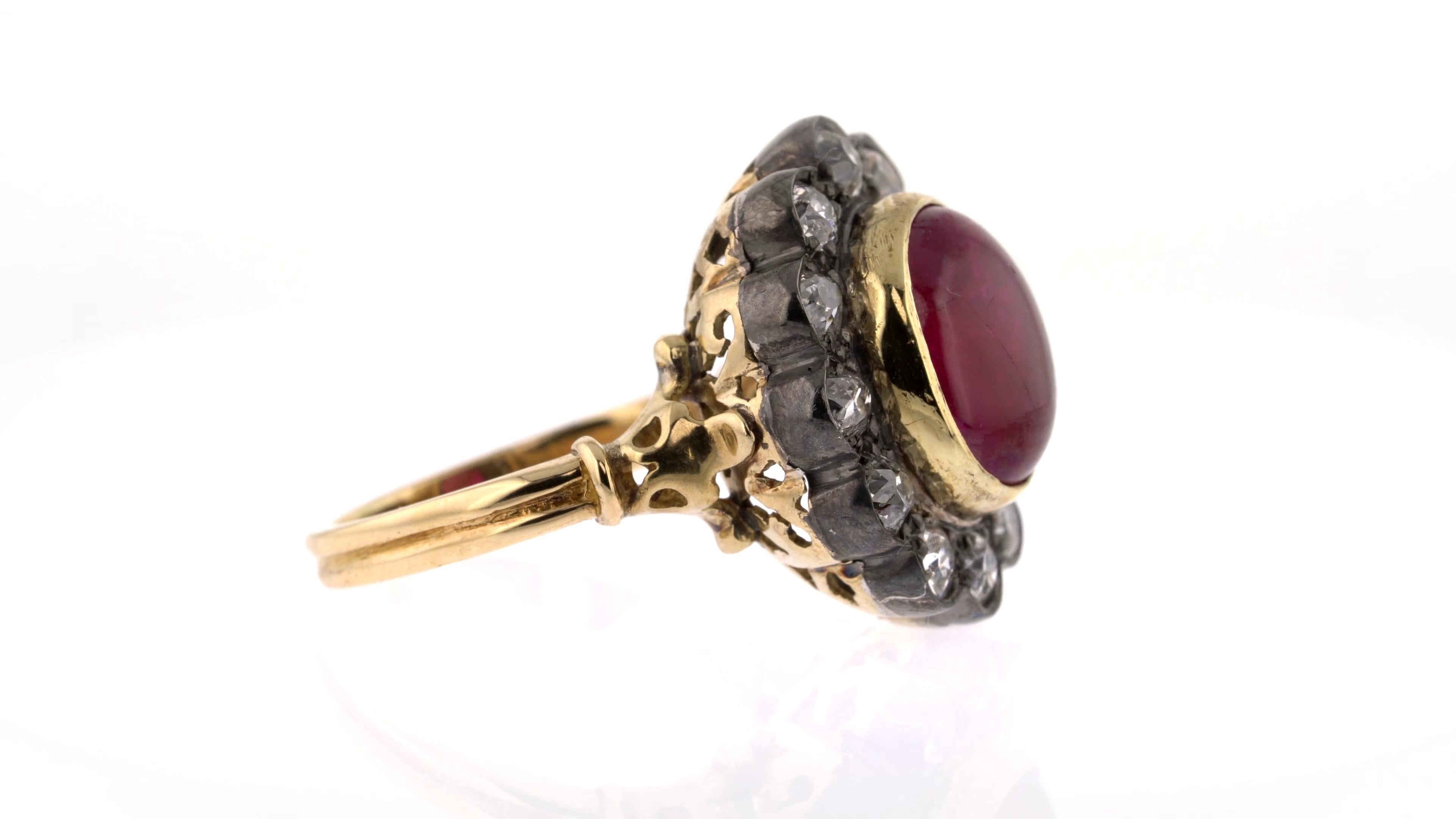 5.51 Carats Ruby Cabochon Ring with a Diamond Halo In Fair Condition For Sale In London, GB